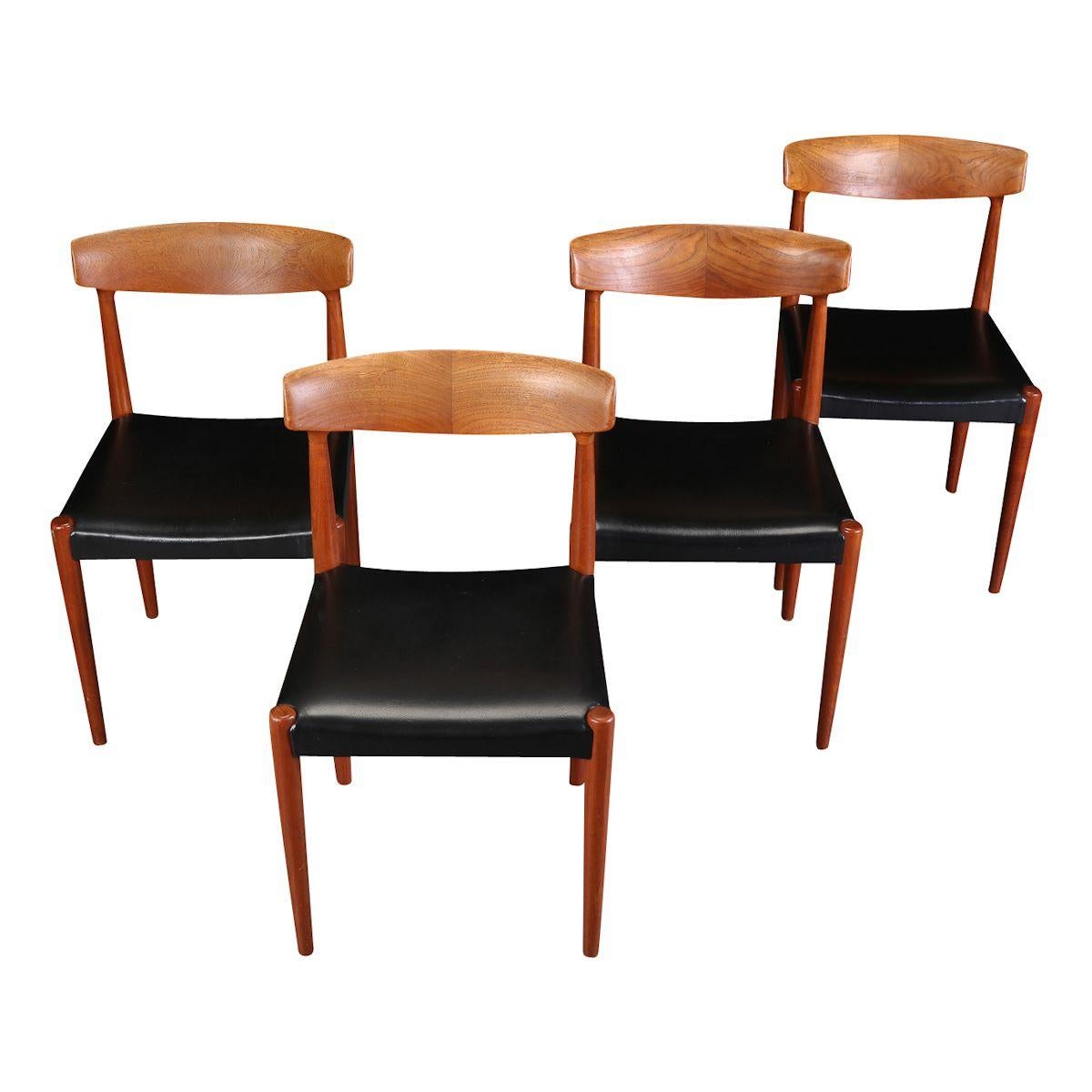 Stylish vintage dining chairs designed by Knud Faerch for Danish manufacturer Slagelse Møbelfabrik. These model 343 chairs feature a typical midcentury Danish organic design, solid teak backrests and beautiful black leather upholstery. This gorgeous