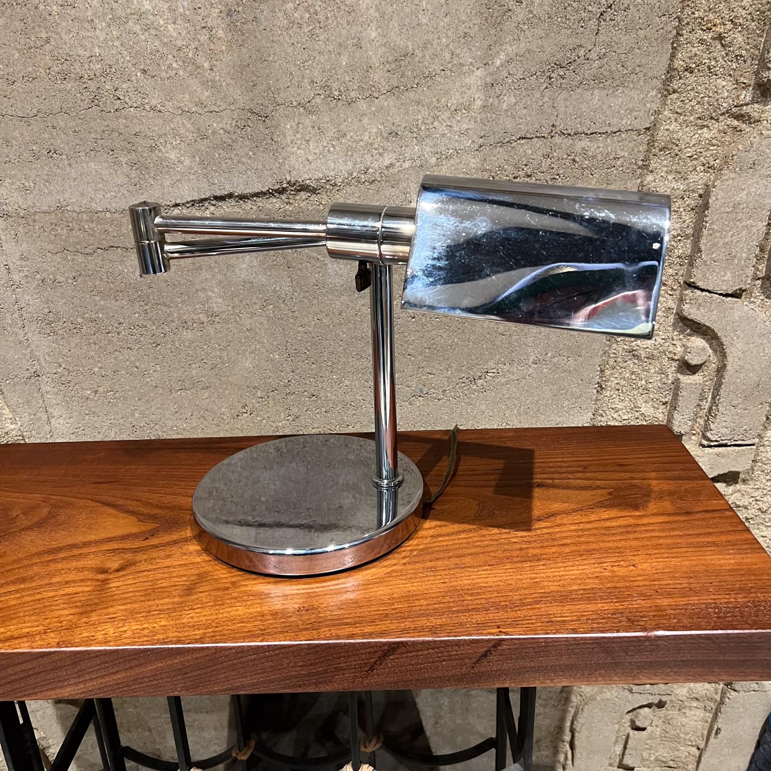 Koch & Lowy Chrome Articulating Swing Arm Desk Lamp
11.13 tall x 14.38 closed x 21 fully extended x 7.88 diameter base
Unmarked
Preowned original vintage condition
Shade has faded areas inside. Chrome is vintage but clean. 
Tested and working.
Refer