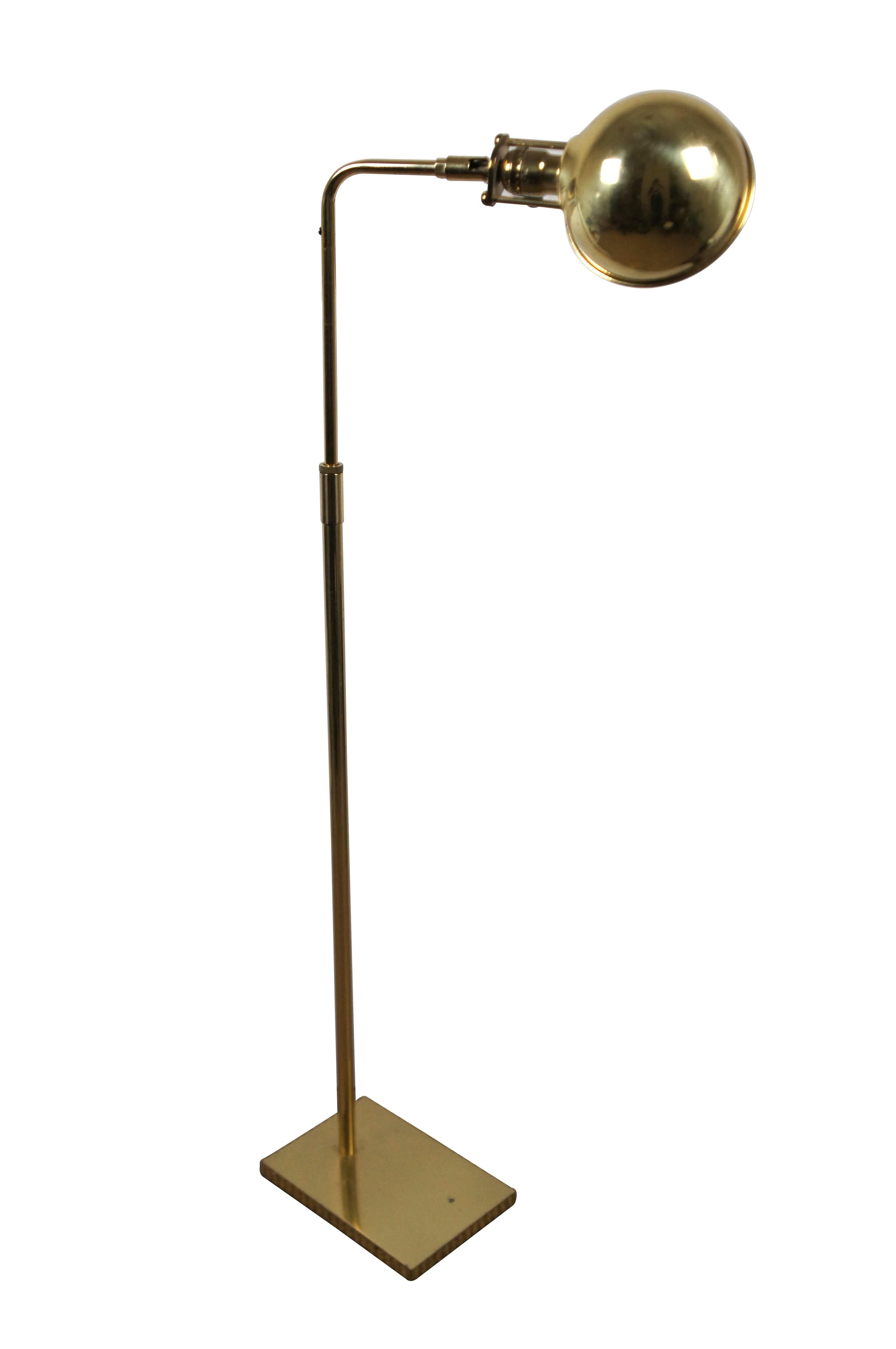 Vintage mid to late 20th century Koch & Lowy / OMI brass pharmacy / apothecary / library reading lamp, featuring a rectangular base, half round shade, adjustable height and dimmable switch.

