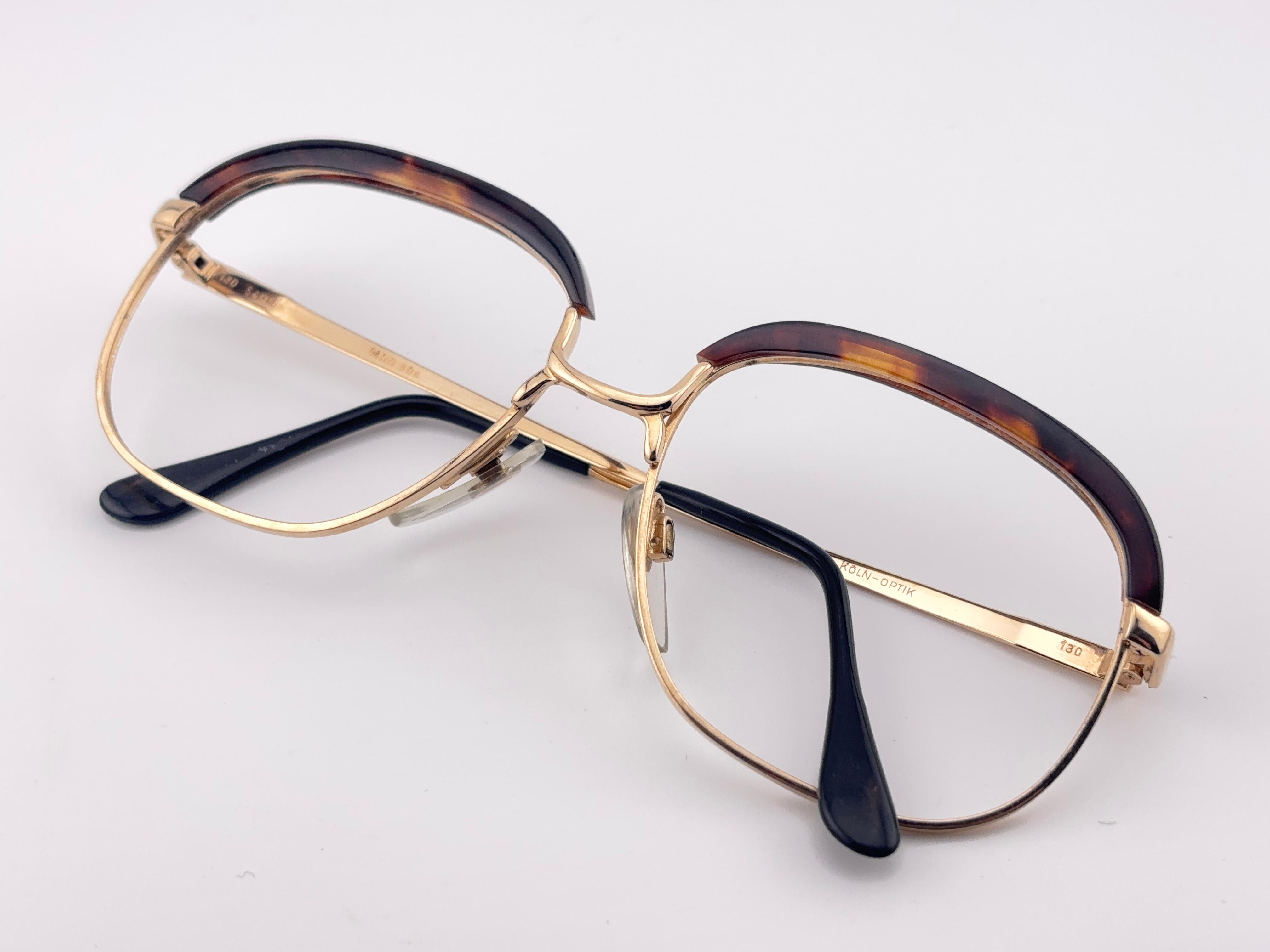 Rare Köln Optik Genuine Tortoise Shell And Gold Combination Frame. 

Suitable For Rx, Prescription Glasses Use. 

Please Notice That This Item Is Nearly 40 Years Old And Could Show Some Storage Wear. 

New, Ever Worn Or Displayed.
Front : 13 Cms