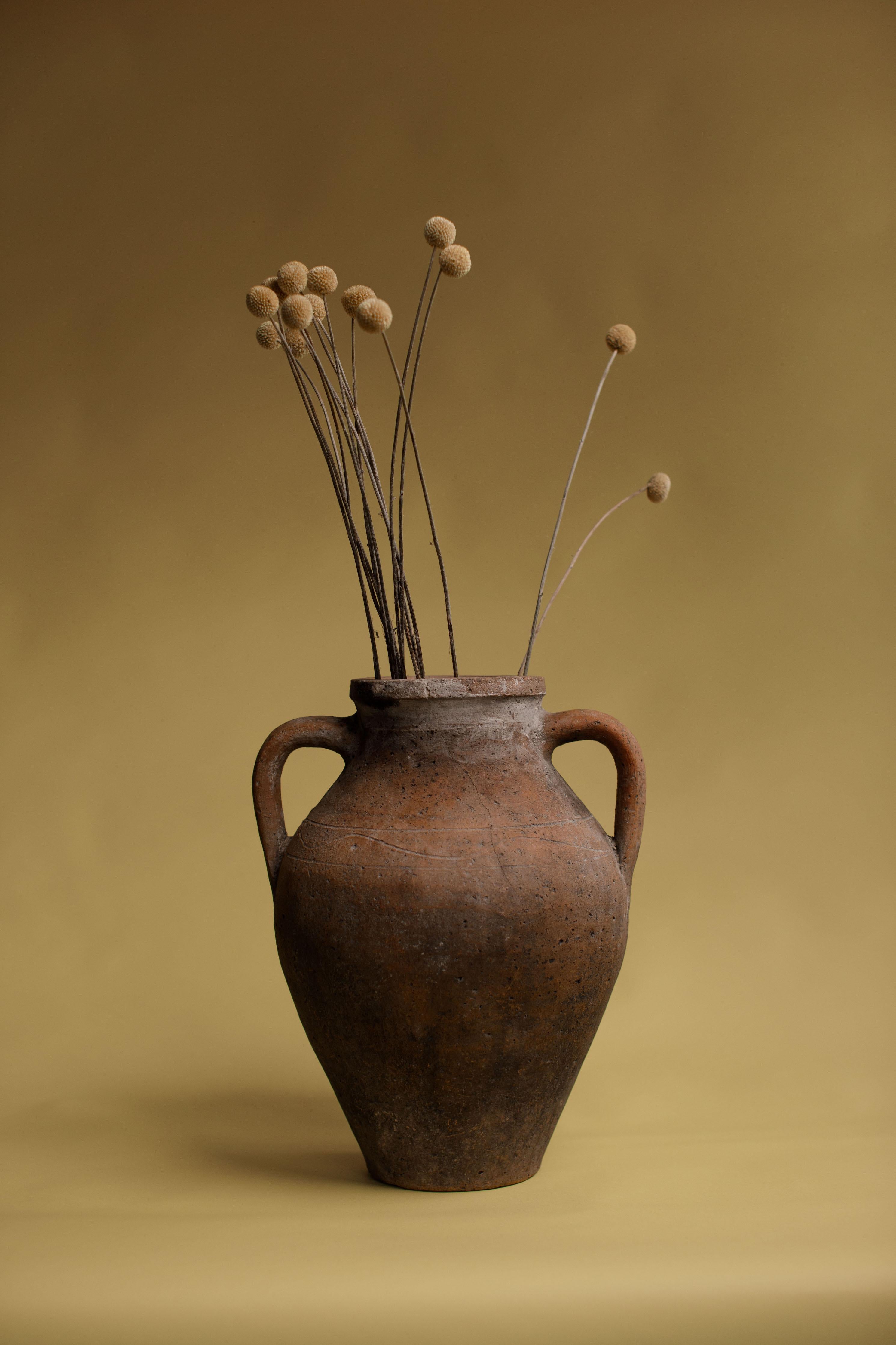 Originating from the Konya region of Anatolia, Turkey, these large ceramic urns were used for storing grains, water, oil, and other perishables. The properties of clay, such as its porosity and insulation, helped to preserve the contents and keep