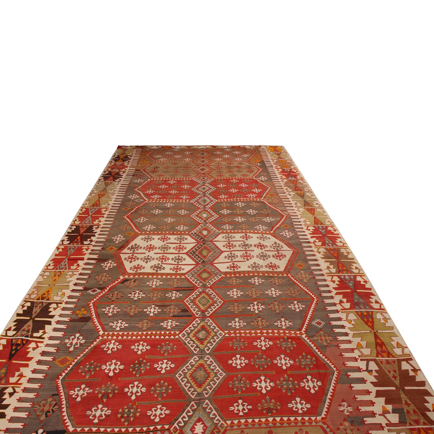 Flat-woven in high-quality wool originating from Turkey between 1930-1940, this vintage Konya Kilim rug enjoys a distinguished grandeur in its field design only select pieces of its era and family enjoy, marrying traditional Turkish symmetry with a