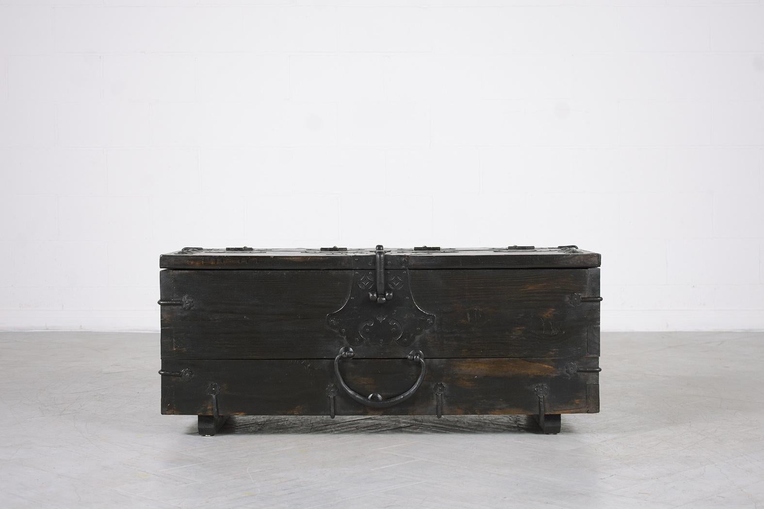 Step into a world of Oriental charm with our Vintage 1950s Chinese Export Trunk, a piece that beautifully marries history with skilled craftsmanship. This small trunk, hand-crafted from wood, has been thoughtfully restored and finished by our team