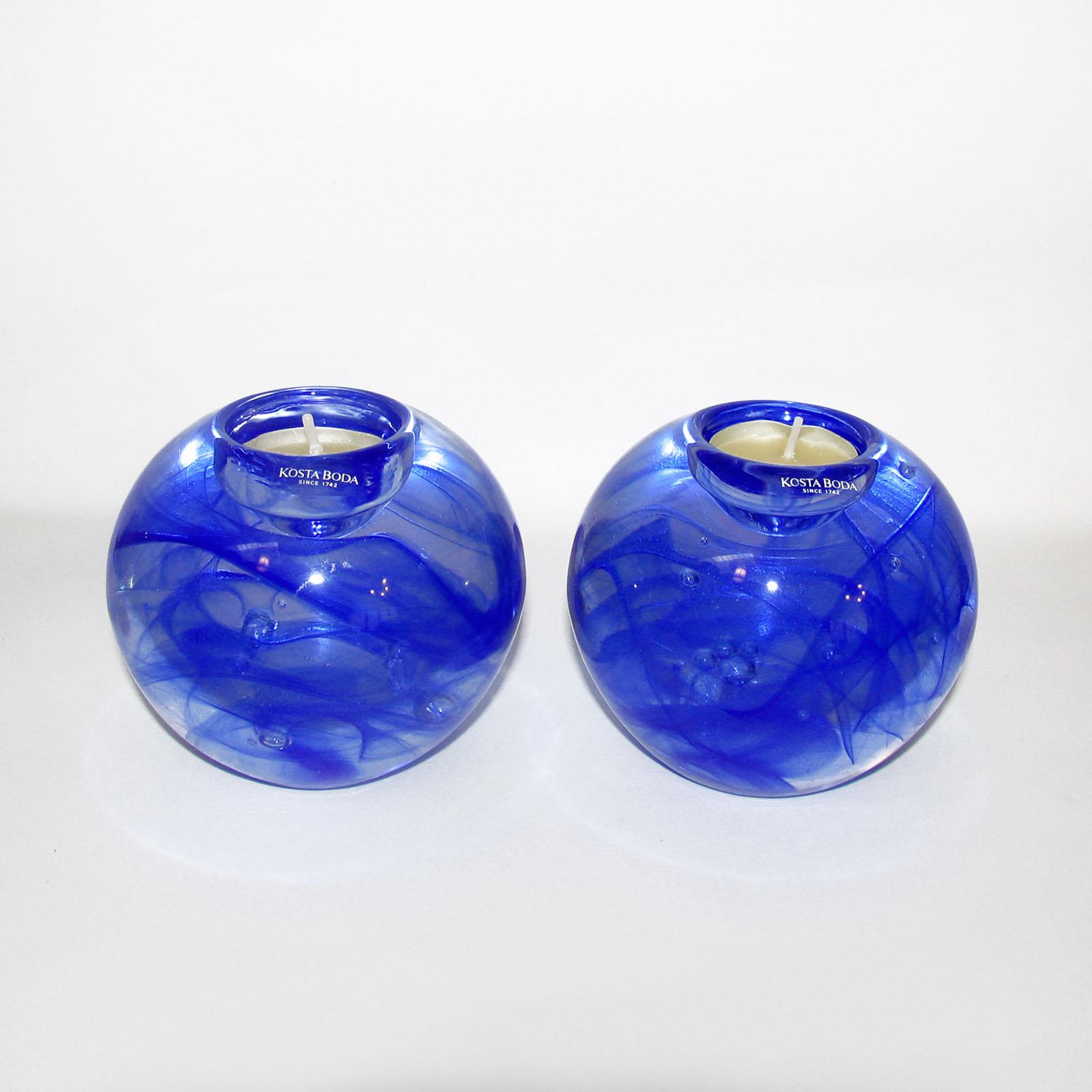 Vintage Kosta Boda blue art glass pair of votives, Sweden, 2000
Blue glass blue Moon votive with swirl motif, designed by Anna Ehrner, manufactured by Kosta Boda. Manufacturer label to the front and acid etched brand stamp at underside.