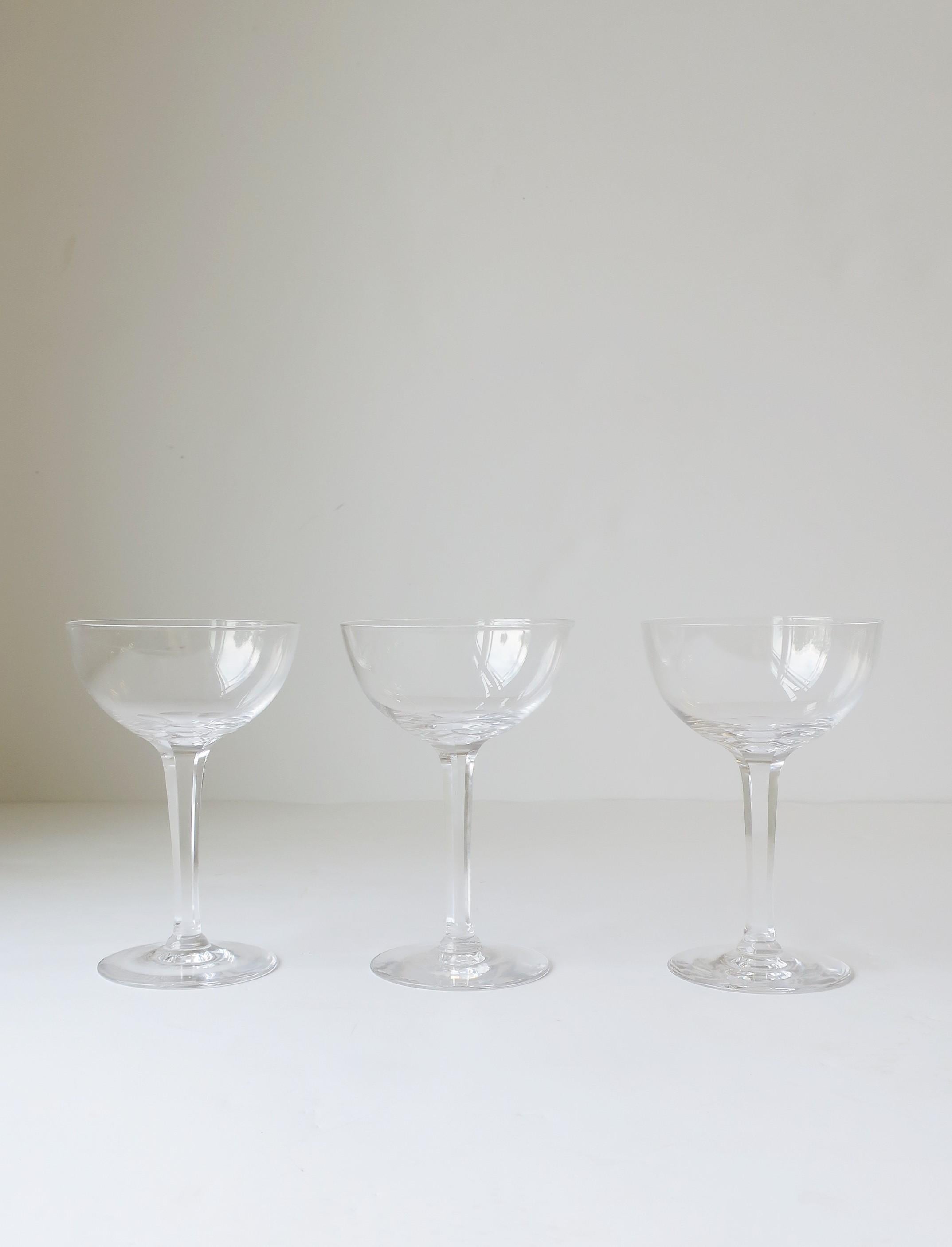 A beautiful set of three (3) rare Midcentury Modern Scandinavian Modern Kosta Boda crystal cocktail, martini or Champagne coupe glasses, circa mid-20th century, Sweden. With maker's mark in two places, on label as shown (image #6) and etched 