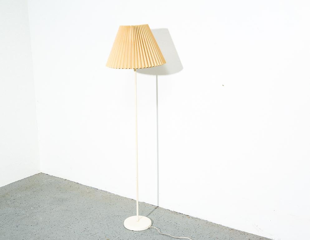 Vintage floor lamp by Kovacs. White enameled stem and base with a pleated linen shade.