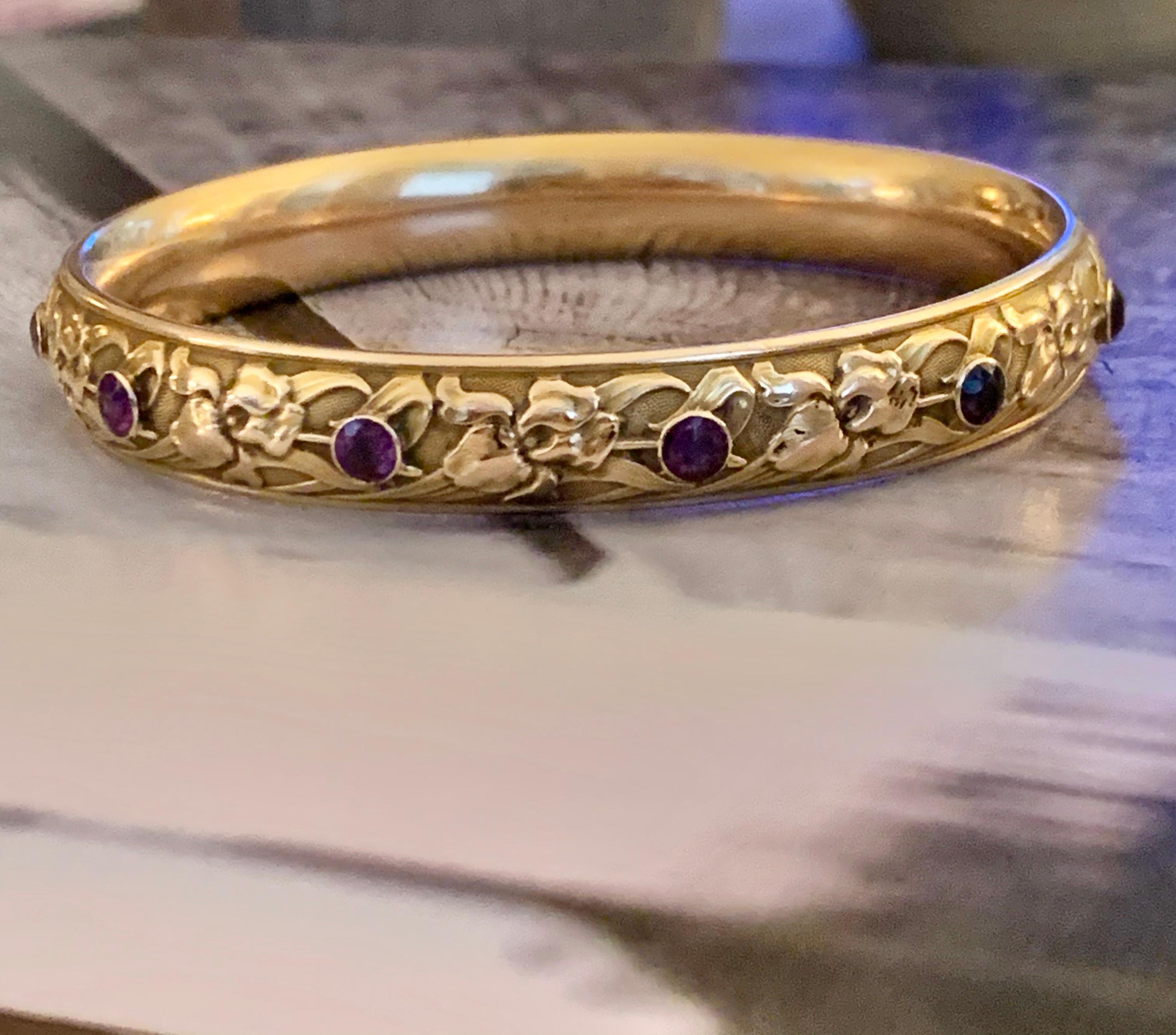 This stunning Krementz signed bangle features 10 Amethyst bezel set all the way around the circumference of this piece.  
Krementz pieces are sought after and this piece is in lovely condition, especially given its age.

Measurements:
Outside: 8