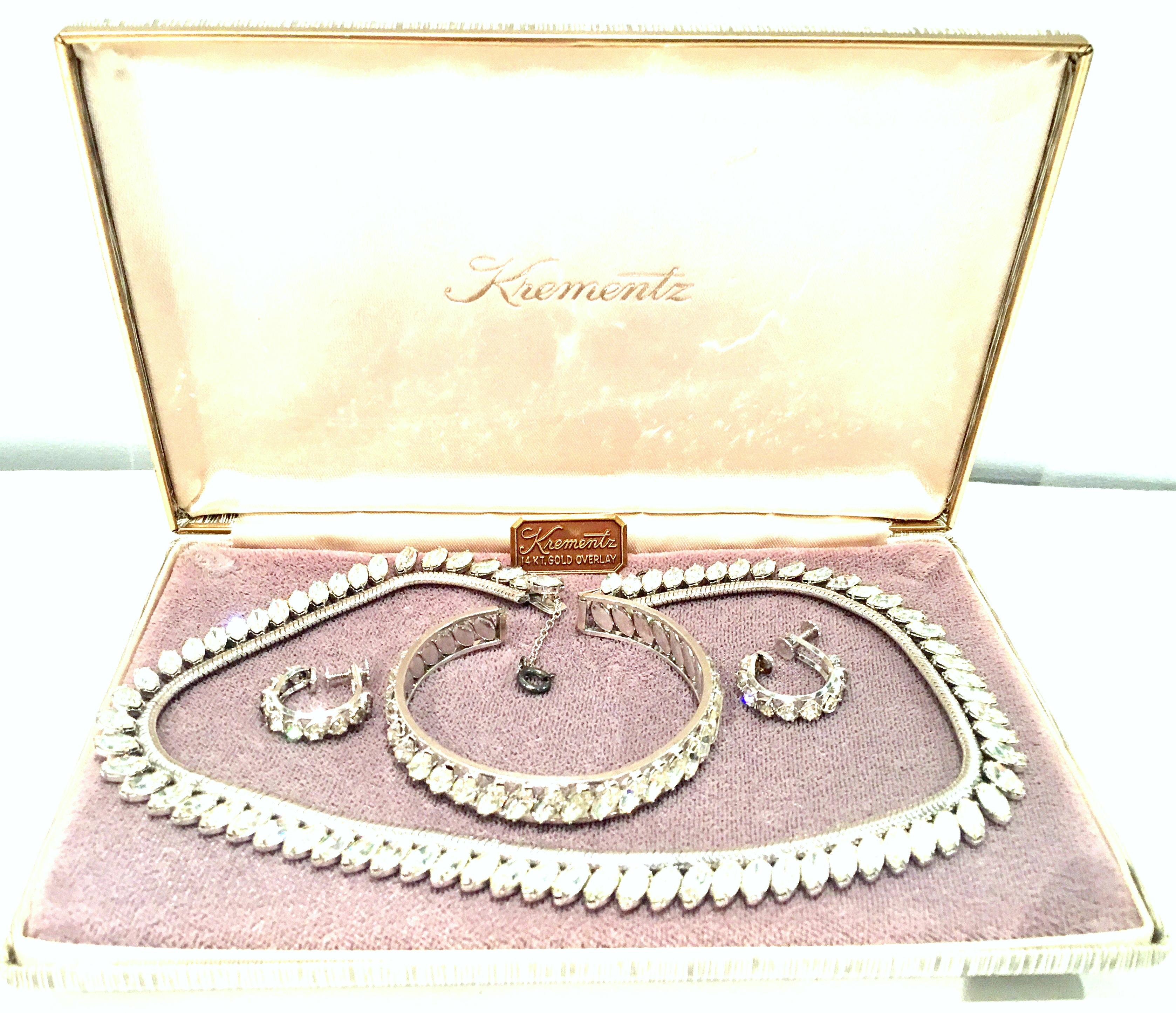 Mid - 20th Century Krementz 14Kt. White Gold & Austrian Crystal Four Piece Demi-Parure Boxed Set. This coveted original box set and full demi parure includes, one choker style necklace, one cuff style bracelet and one pair of screw back hoop style