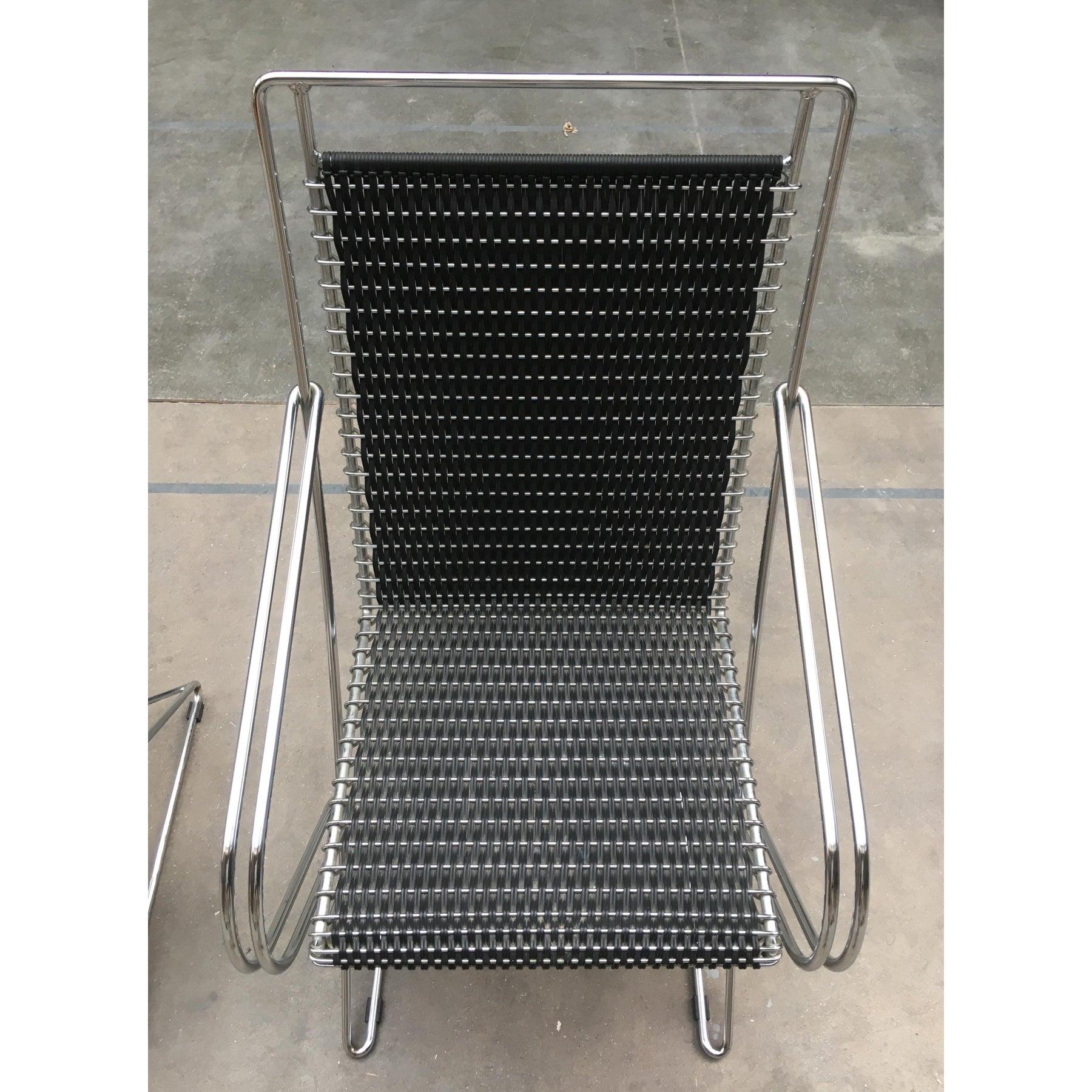 This is an original Till Behrens Kreuzschwinger chair or armchair in a rare version with woven braid and armrest. It is an elegant design classic, the further development of the cantilever chair. The chairs are completely made of gefertig steel