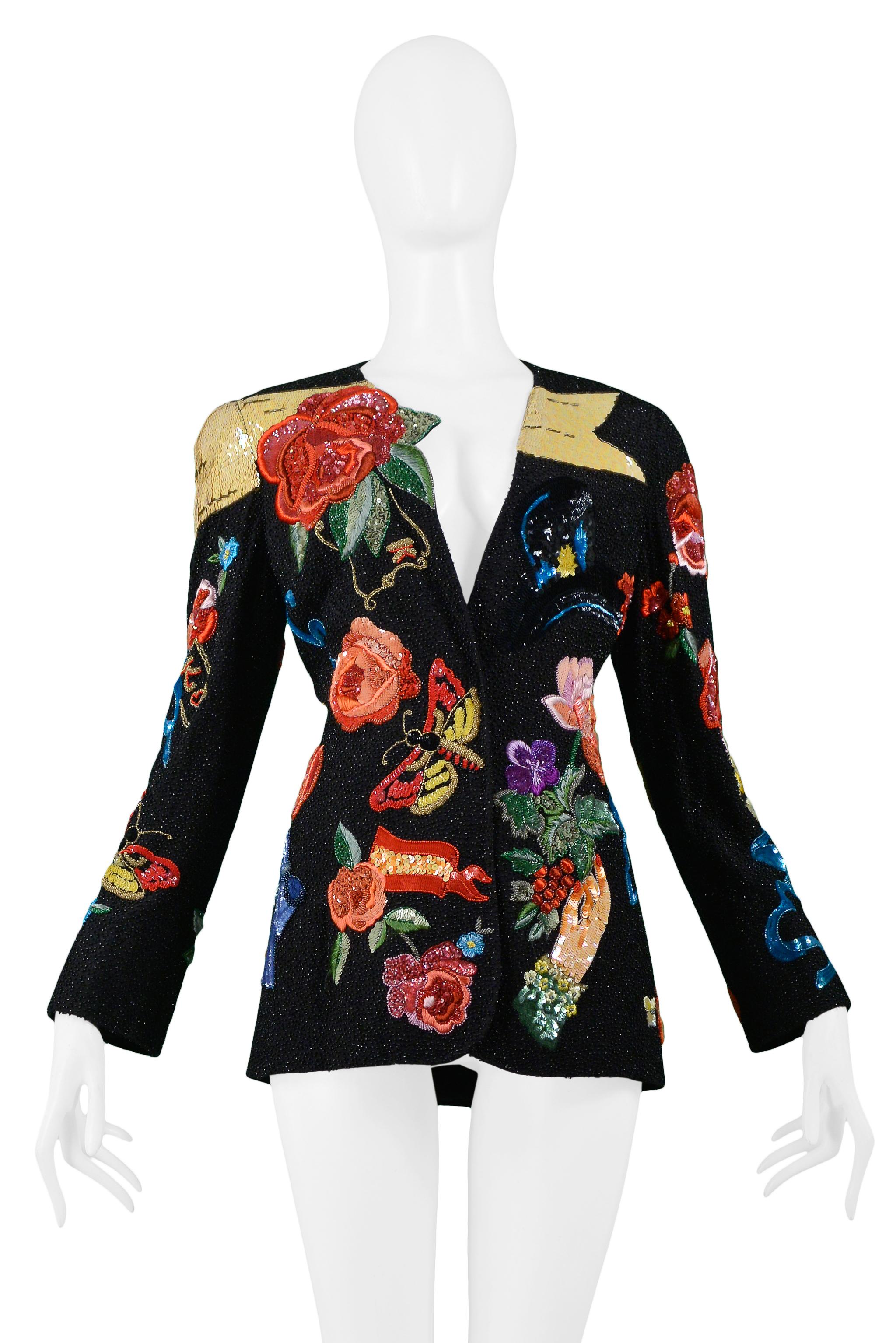 Vintage Krizia 100% silk black heavily beaded and embroidered jacket with bows, roses, butterflies, hand, and portrait. The jacket features a slim fit, deep V neck, black acetate lining, and three hidden snap closure. From the 1991 runway