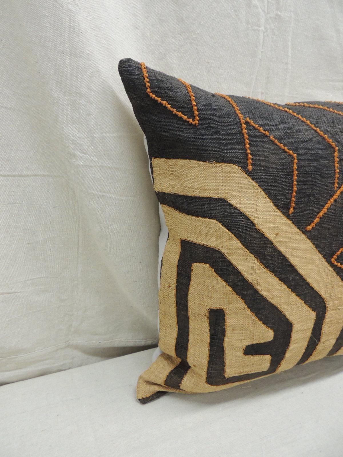 Vintage Kuba orange and black handwoven patchwork African decorative pillow.
Handwoven patchwork and appliqué raffia African decorative lumbar pillow with labyrinth pattern and orange beads woven on the textile.
Light gris color cotton