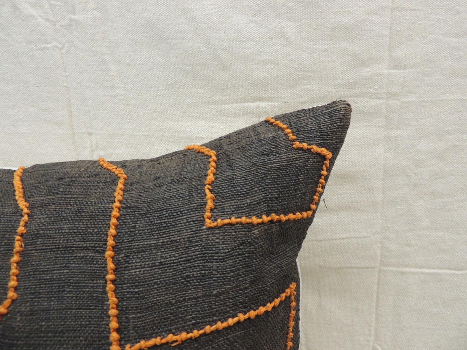 Vintage Kuba orange and black handwoven patchwork African decorative pillow.
Handwoven patchwork and appliqué raffia African decorative lumbar pillow with labyrinth pattern and orange beads woven on the textile.
Light gris color cotton