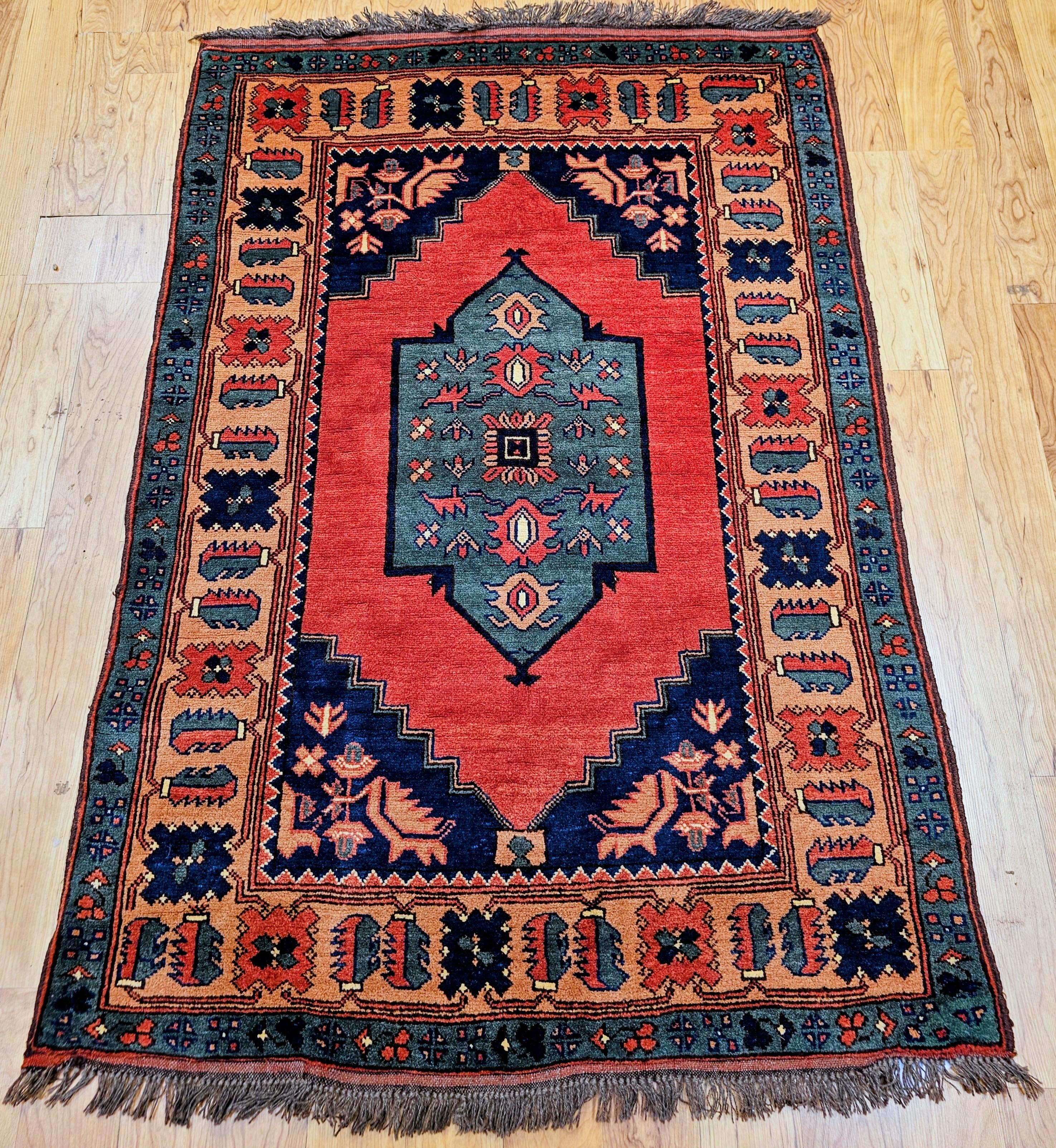 Vintage Kurdish Tribal area rug skillfully hand woven by the Kurdish villagers in Southeast Turkey. The Kurdish village rugs are celebrated for their bold designs, brilliant natural colors, and robust, durable construction.
This beautiful small