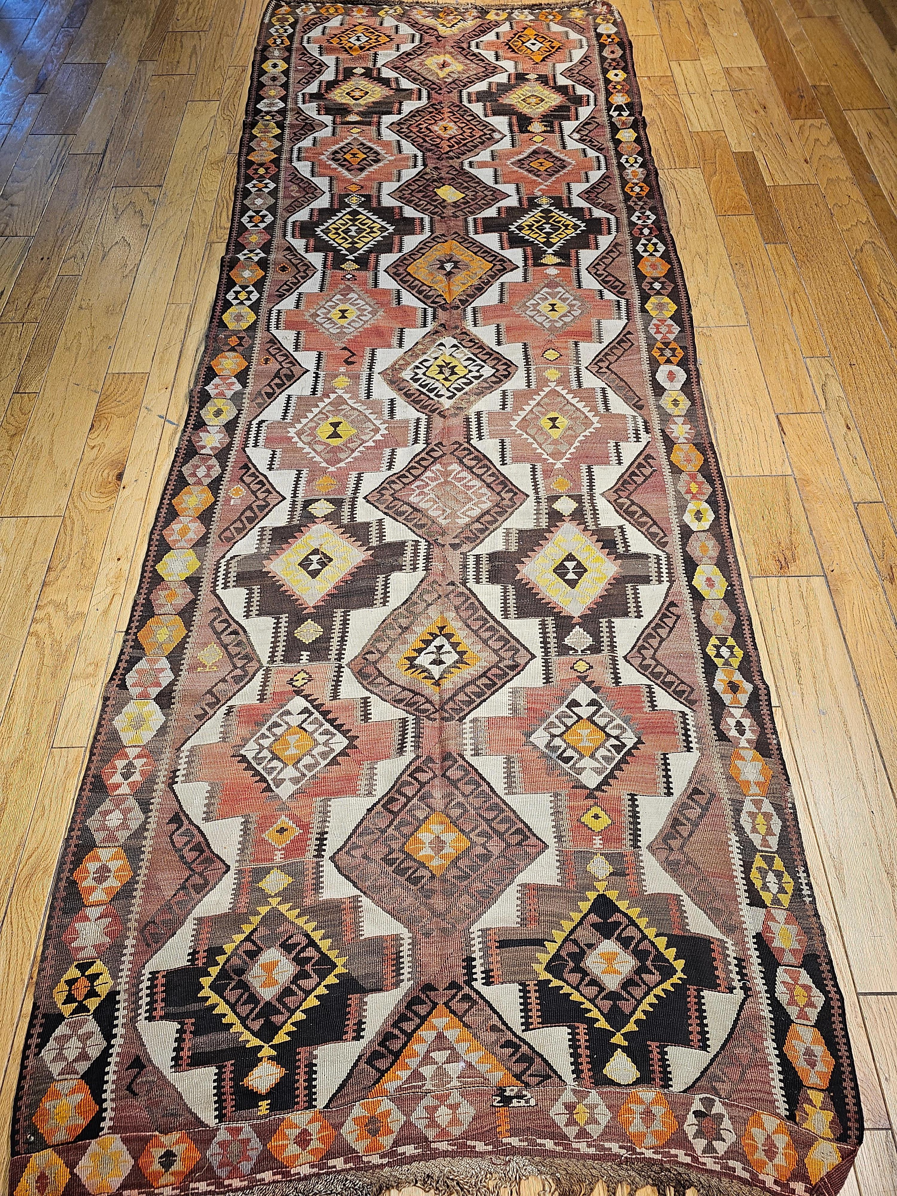  Beautiful vintage Kurdish kilim from Eastern Turkey in an all over geometric design from the early 1900s. This Kurdish Kilim is  unique since its design resembles the kilims from the southern Caucasus.  In addition, the use of the ivory color