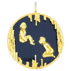 Pendentif vintage Kutchinsky en or 18 carats avec onyx, représentant le signe du zodiaque Gémeaux, dans son coffret d'origine