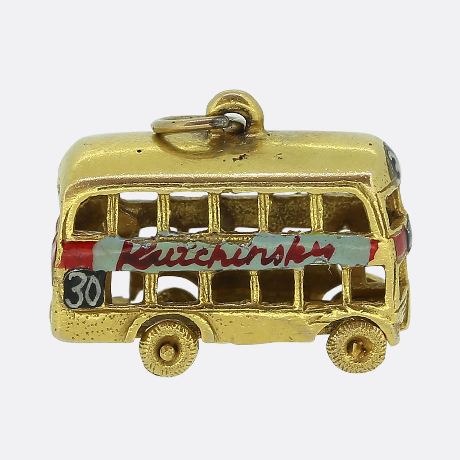 Here we have a wonderful 9ct yellow gold bus charm that dates back to the 1970s. The bus is enamelled on both sides with the word 'Kutchinsky' although this is slightly worn on one side. 
The bus is hallmarked to London 1977 with the makers mark