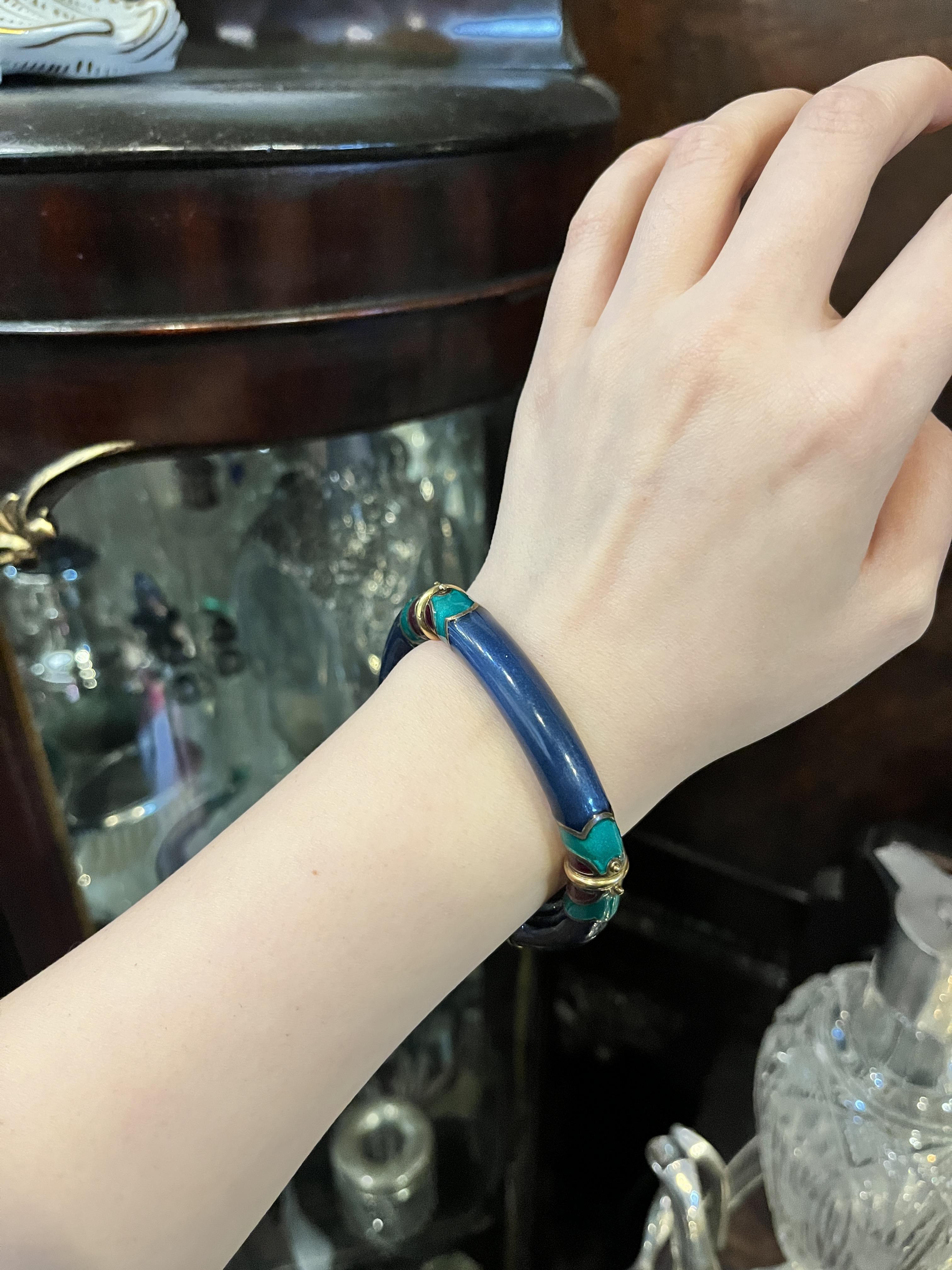 Vintage La Nouvelle Bague 18K Gold Enamel Bracelet

Marked:
LA NOUVELLE BAGUE
18K

Approximate Dimensions:
17 cm (Circumference) 
1 cm (Width)
39.6 grams in weight.