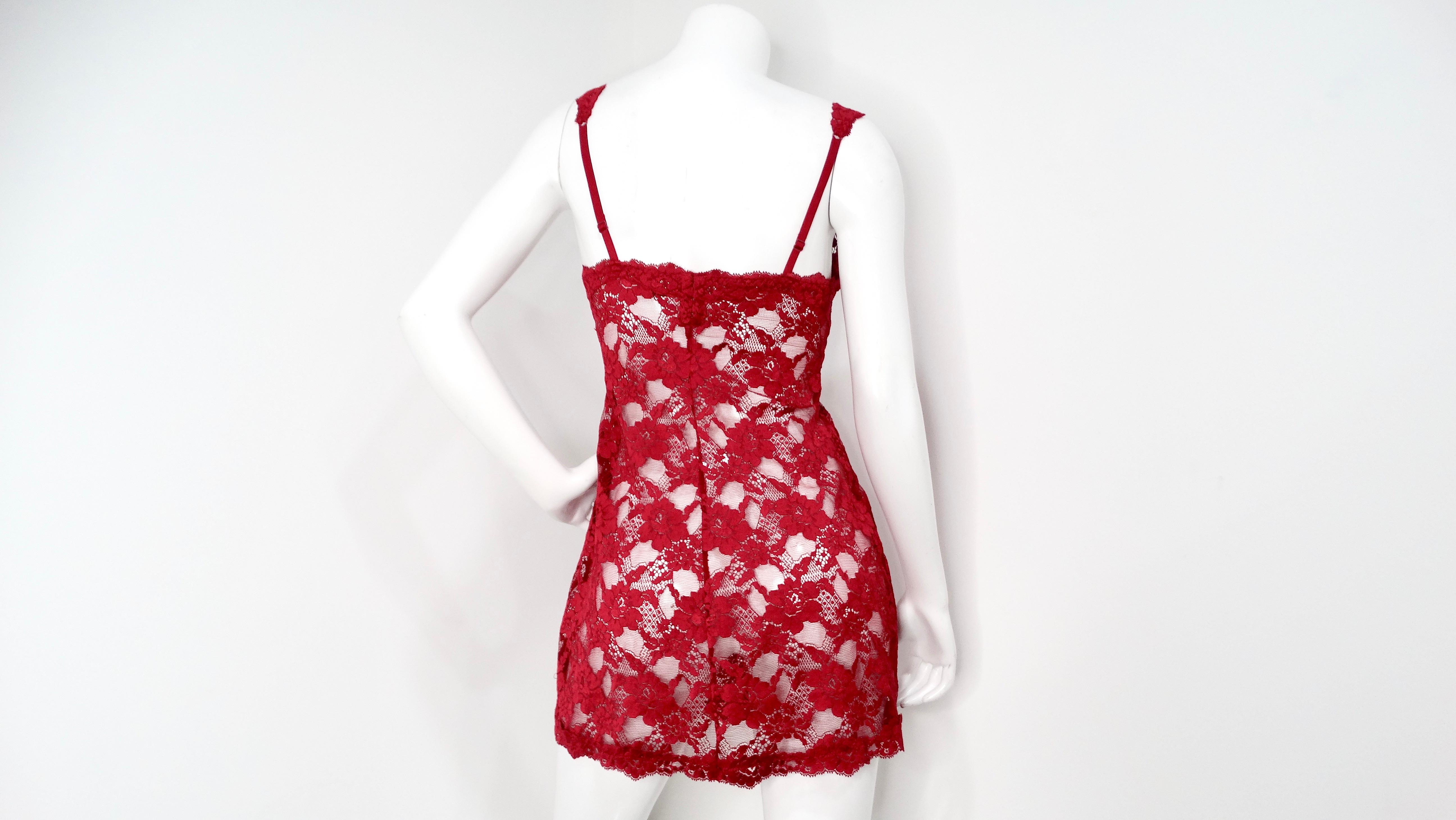 This exquisite vintage La Perla red lace slip dress is a timeless piece of lingerie. The luxurious red lace drapes delicately, offering a touch of vintage glamour. Designed with adjustable straps for a perfect fit, this slip dress is a celebration