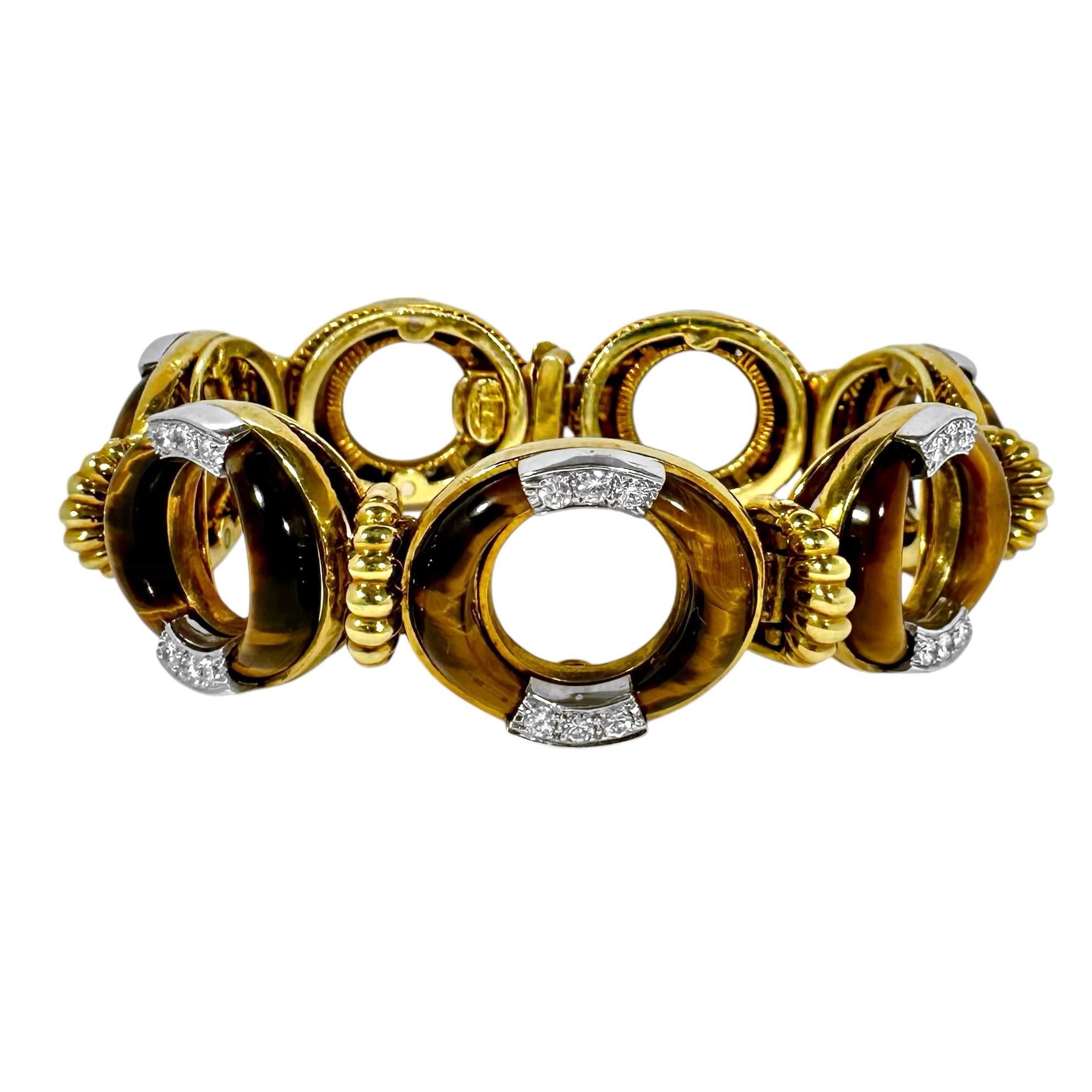 The highly regarded American manufacturer, La Triomphe, was the source of innumerable expertly crafted and beautifully designed items of fine jewelry during the last century. This artfully crafted 18K yellow gold, tiger's  eye and diamond bracelet