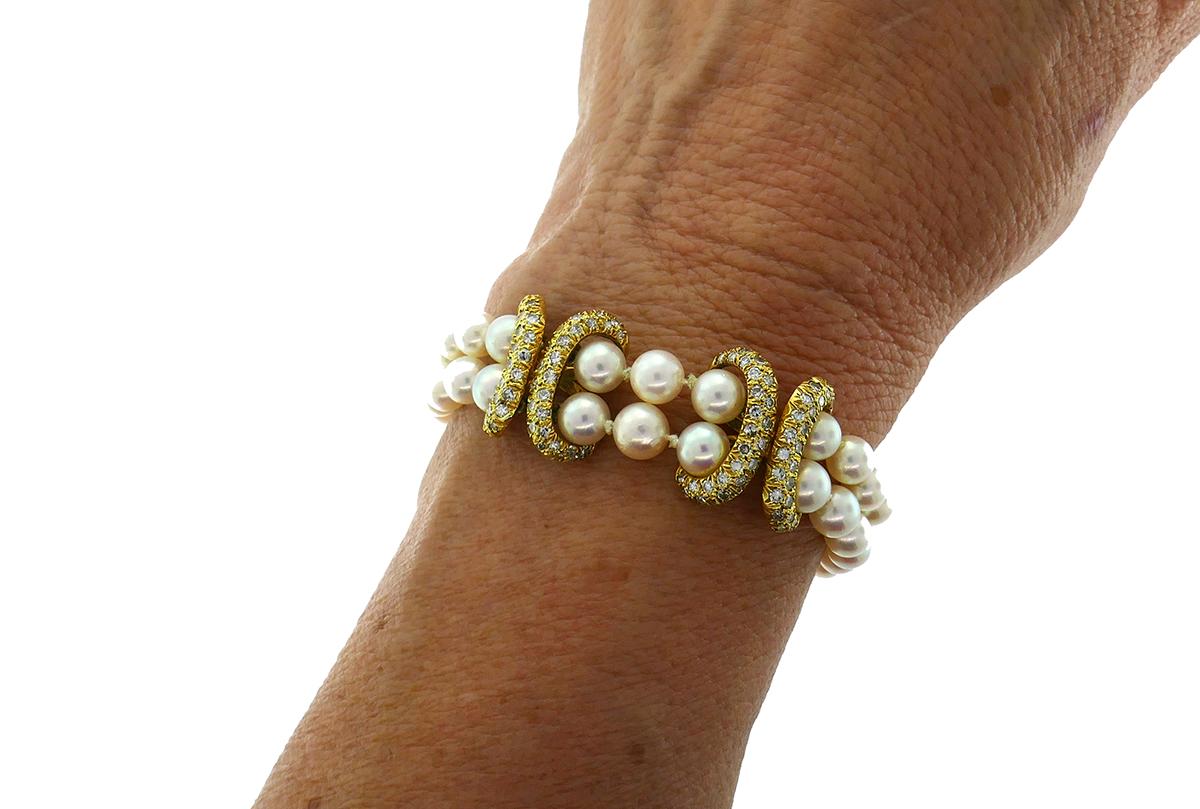 Elegant bracelet made of fifty 5.6-mm in average Akoya pearls, 18 karat yellow gold and round brilliant cut diamonds (G-H color, VS clarity, 0.52 carat total weight).
Measurements: 7-1/4 x 5/8 inches (18.5 x 1.7 centimeters). 
Weight:  24.1