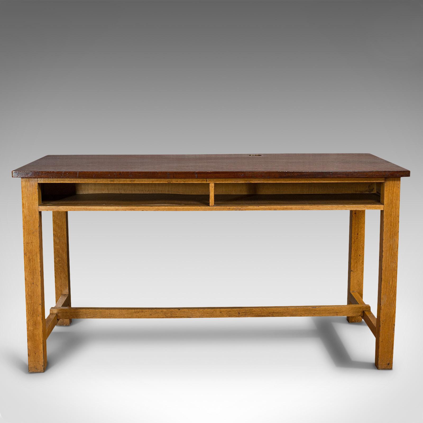 This is a vintage laboratory table. An English, teak over oak base kitchen or dining table with inset J&J Siddons iron weight, dating to the mid-20th century, circa 1960.

Attractive timbers and hues
Displays a desirable aged patina
27mm (1