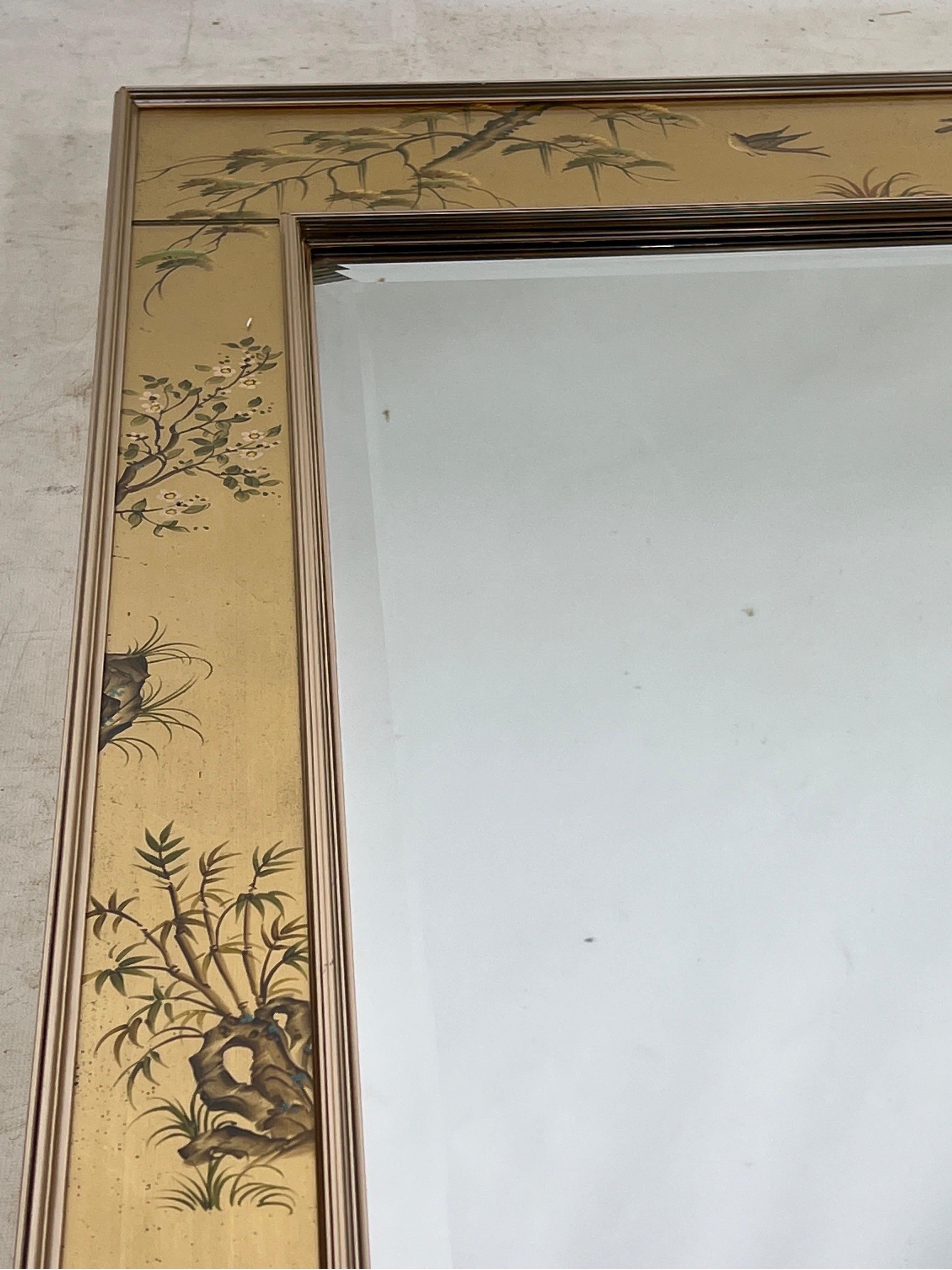 Introducing an exquisite LaBarge reverse hand-painted mirror, a truly stunning piece of artistry. Crafted with meticulous attention to detail, this mirror boasts exceptional quality and durability. Its creation dates back to the year 1986, adding a