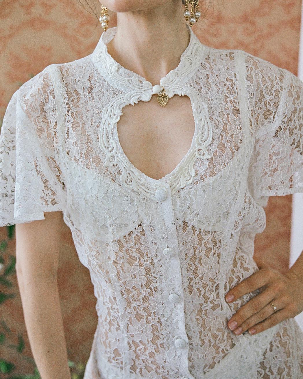 This vintage lace dress features a heart-shaped cutout at the high neckline— it comes with a matching white slip, but i also love it worn sheer. (See last images to see it with slip.) It makes an amazing dress to layer over aa swim suit in a beachy
