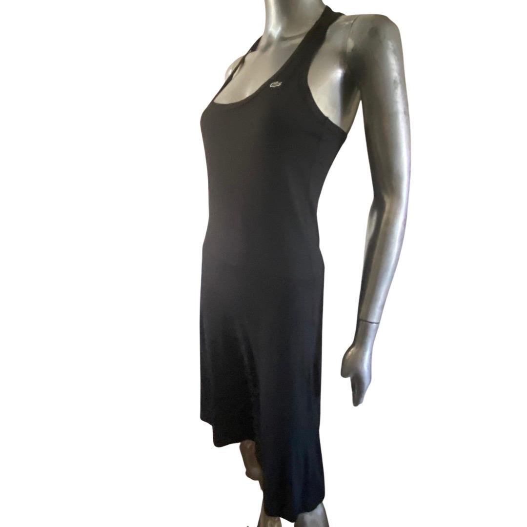 A vintage 70s racer back tank dress by Lacoste, France. This sporty dress never goes out of style and is very collectible. The dress is simple but has a interesting panel inset in the hip that makes the dress very flattering on. Brilliant design.