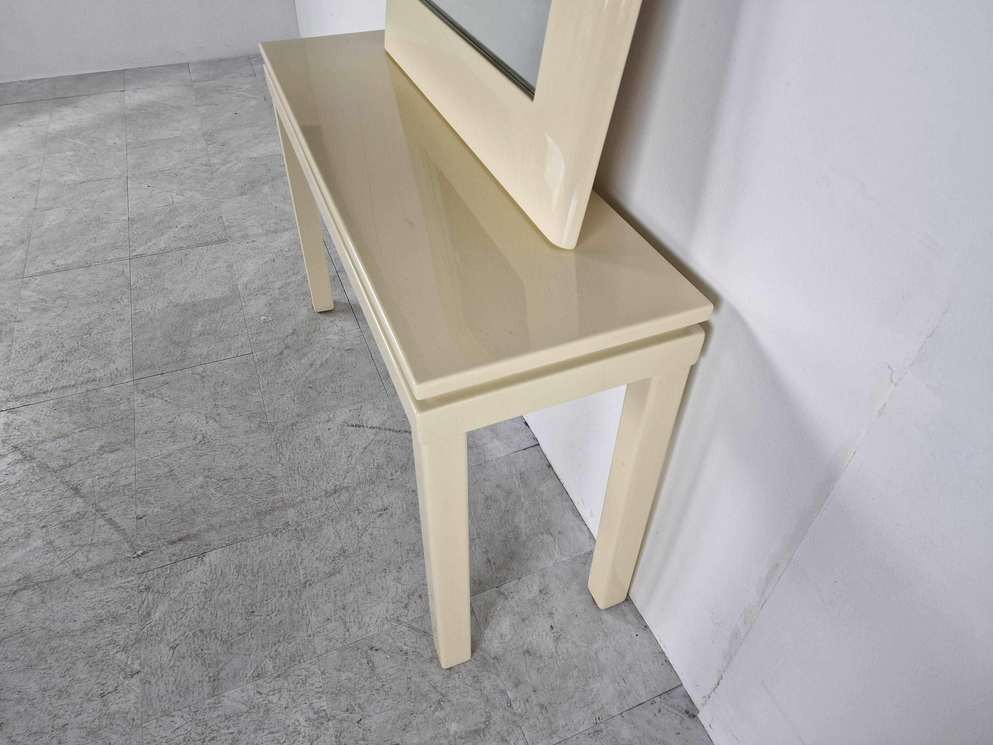 Vintage beige lacquer console table with matching mirror.

In the style of Jean Claude Mahey.

Probably by roche Bobois.

1980s - France

Good overall condition witht age related wear.

Dimensions:
Height: 70cm/27.55