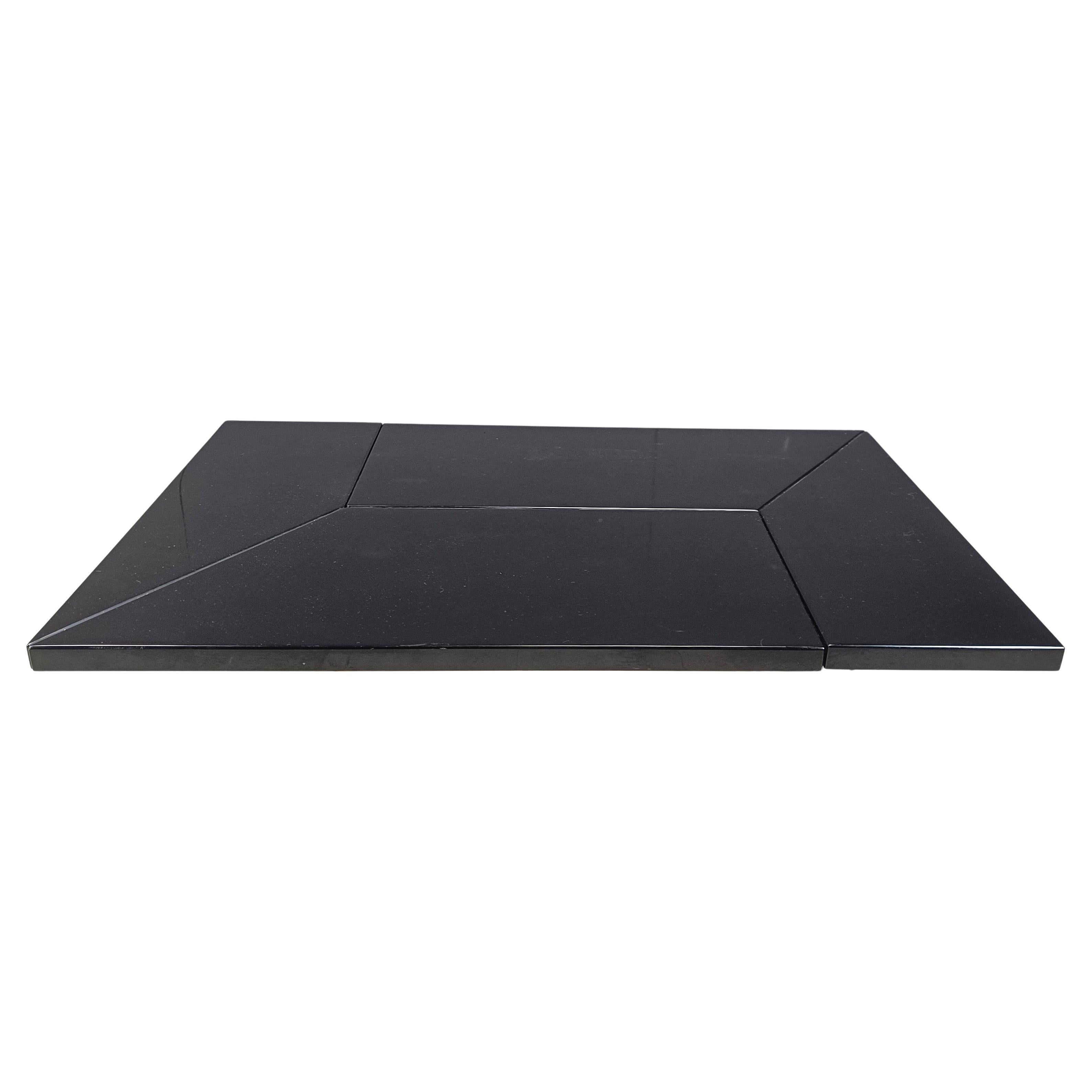 Lacquered wood coffee table designed by Paul Michel.

This luxurious coffee table is cleverly designed and slides open to reveal a mirrored spacious looking dry bar

The use of mirrored glass both inside and outside and the beautiful wooden top