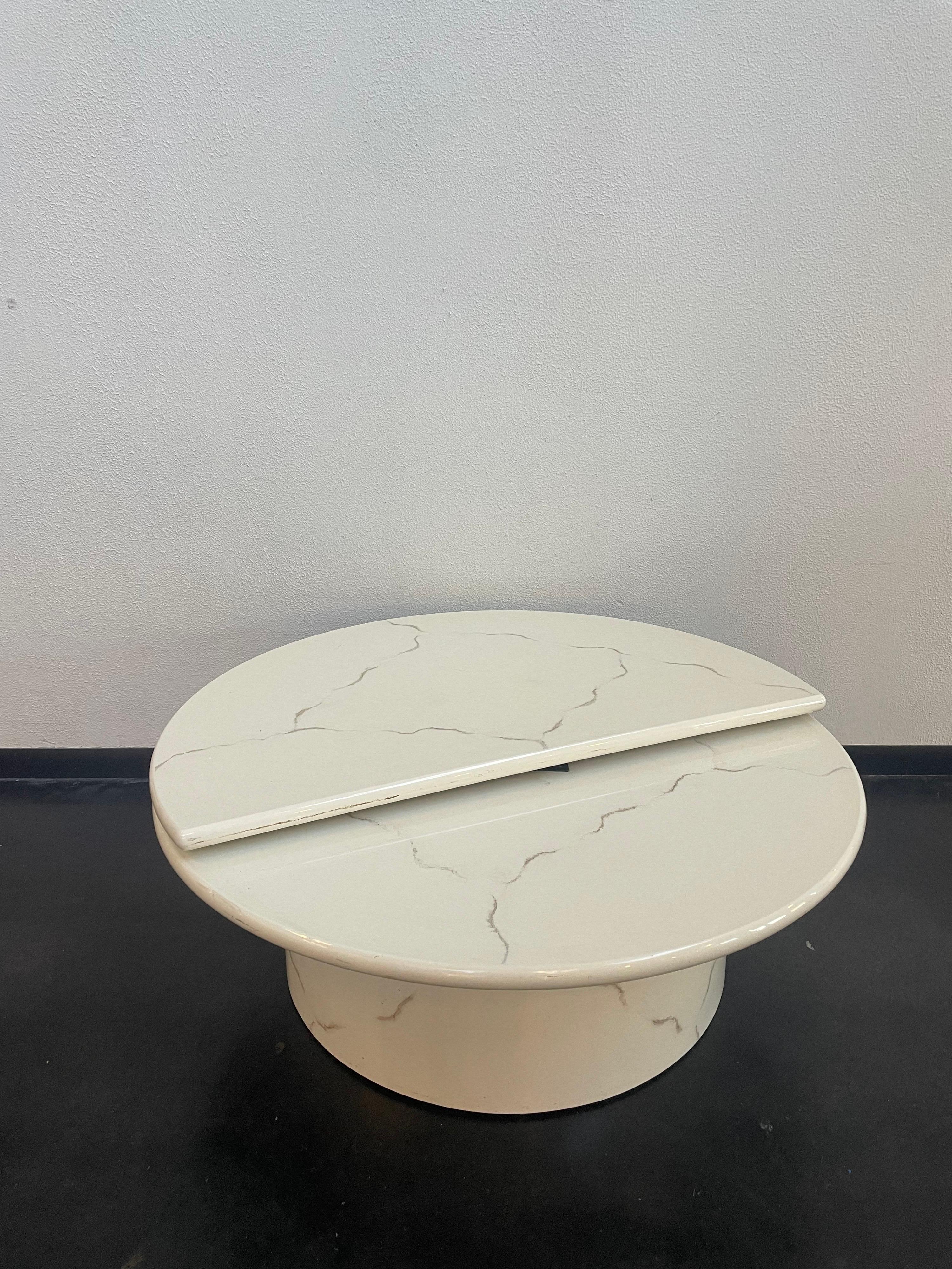 Vintage 1980s, Lacquer Swivel coffee table. The table has a marble-like pattern throughout. The pattern is a light grey.

Measurements:
(Full Circle)
Diameter: 43 3/4