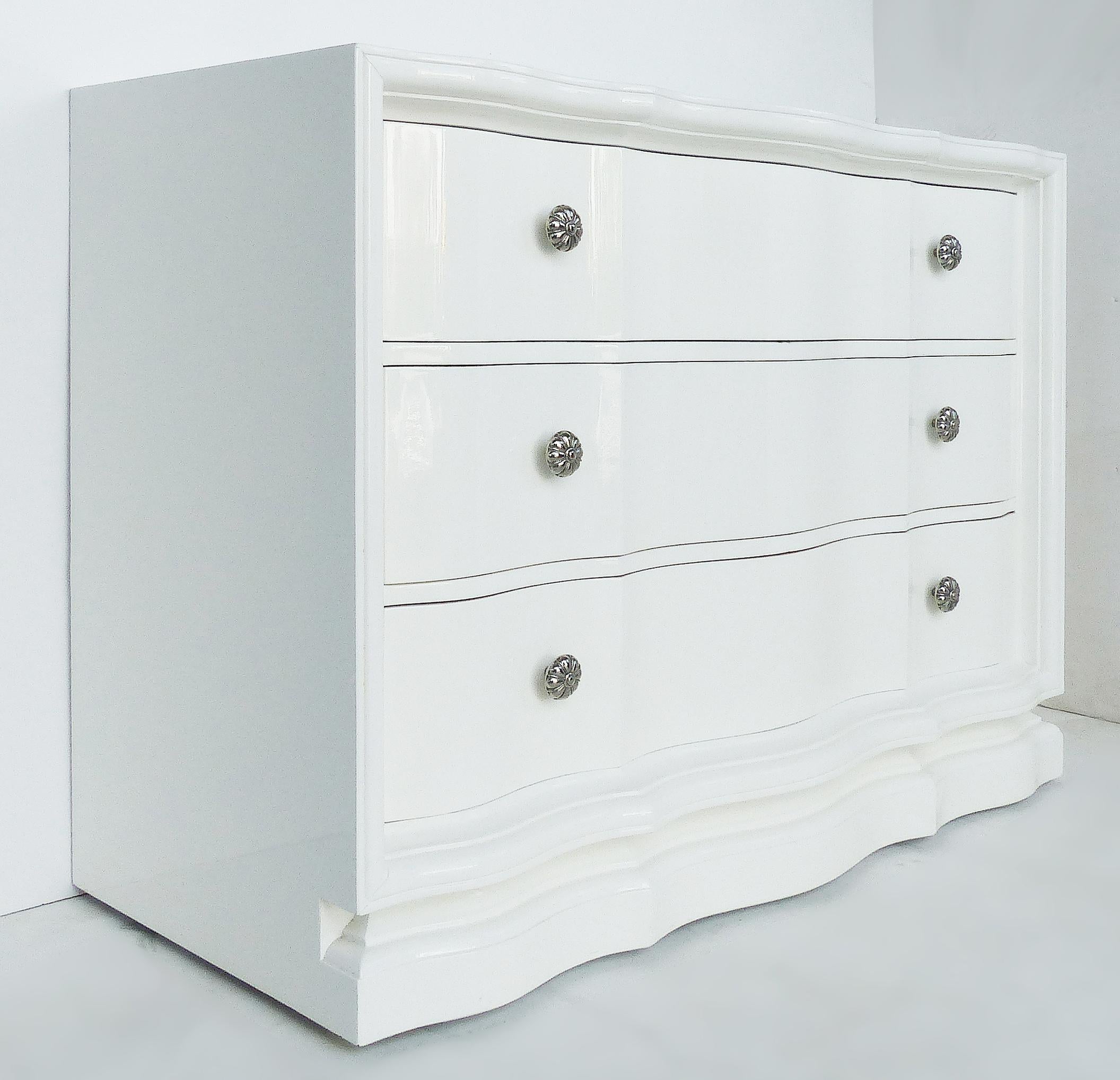 Vintage lacquered chest of drawers with scalloped, wavy drawers

Offered for sale is a pair of fine quality white lacquered chests of drawers with scalloped, wavy drawer fronts. The chests have been recently lacquered including the interiors of