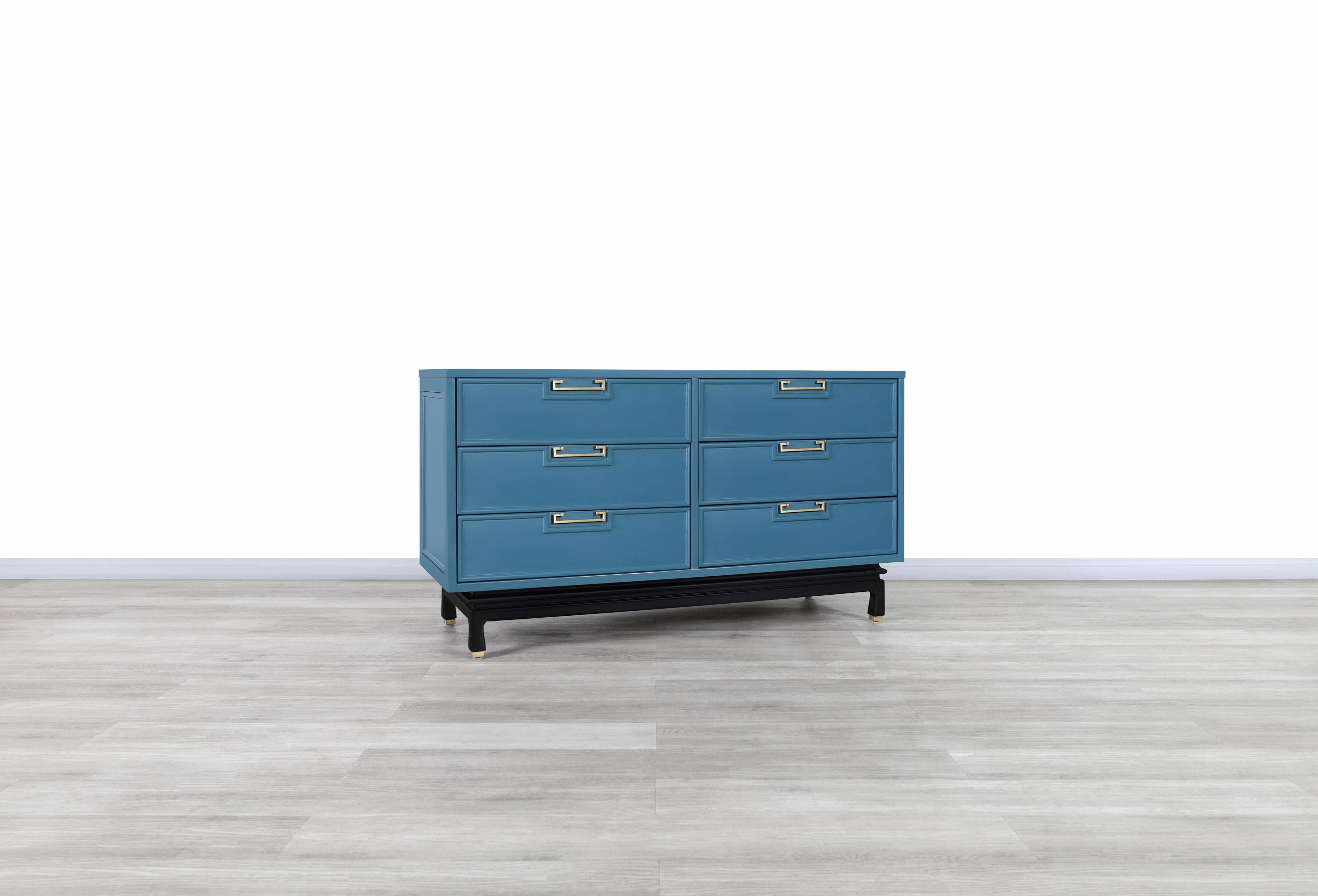 A stunning vintage lacquered dresser designed and manufactured by American of Martinsville in the United States, circa 1950s. This elegant dresser has been professionally restored in a bellbottom blue lacquer finish. Features six dovetailed drawers