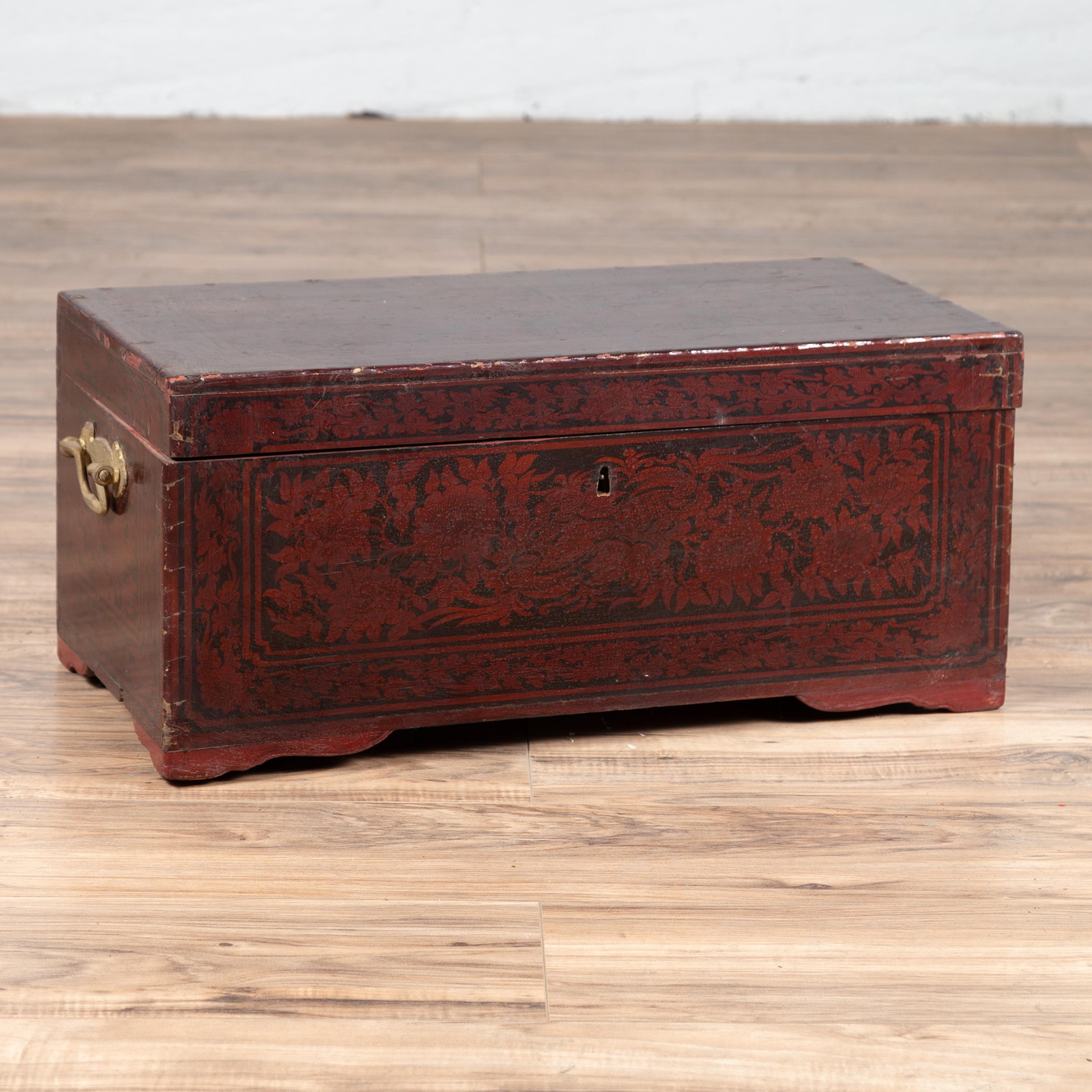 A small vintage Indonesian Palembang lacquered leather chest from the mid-20th century, with burgundy patina. Born in Palembang, southern Sumatra, this exquisite leather chest features a linear silhouette, perfectly complimented by its burgundy