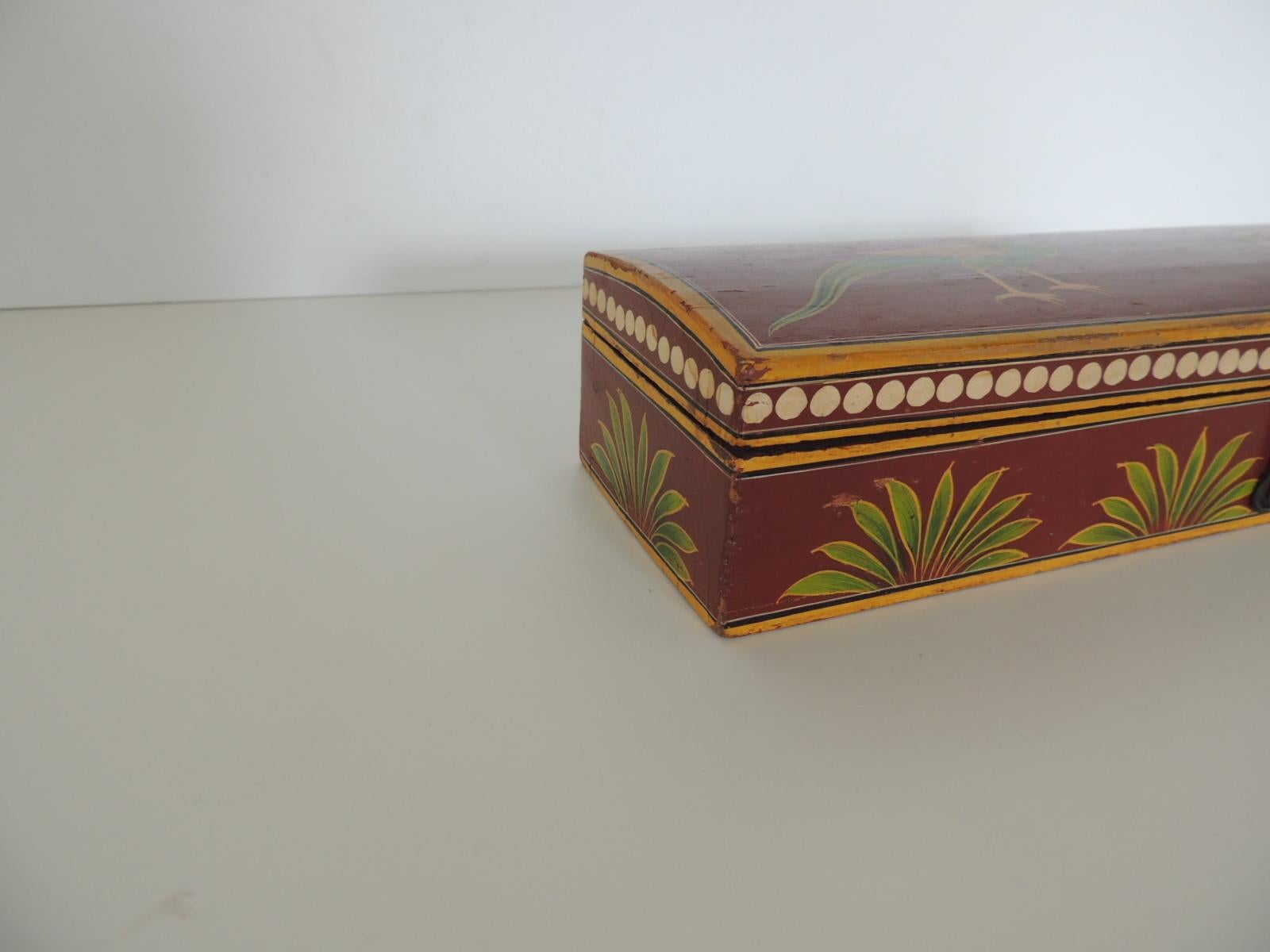 Vintage lacquered pen box depicting birds and palm trees.
Hand painted on all sides in shades of green, yellow, red, white and black.
Three compartments inside, forged metal clasp.
Size: 12