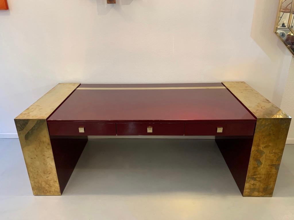 Impressive vintage lacquered wood and brass presidential desk by Jean Claude Mahey, France ca. 1970s
Signed with brass label on the bottom of one base.
3 front drawers with brass handles.
Brass inlay on the table top.
The brass on the bases can