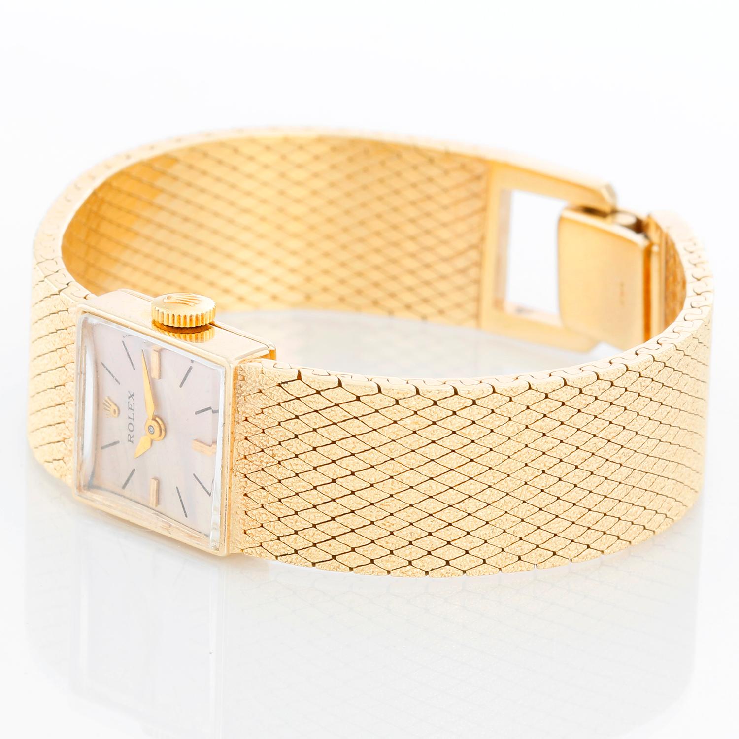 Vintage Ladies 14k Yellow Gold Square Ladies Watch on Mesh Bracelet - Manual winding. 14k yellow gold case (15mm x 15mm). Silver dial with stick markers. 14k yellow gold integrated mesh bracelet with Rolex crown on clasp (will fit apx. 5-3/4 in.