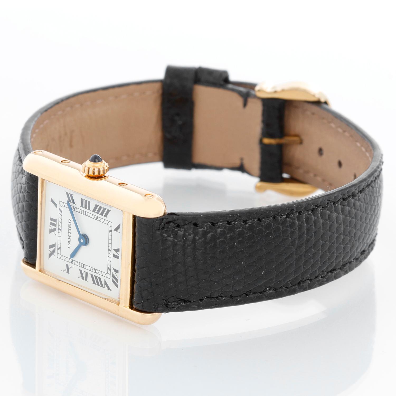 Vintage Ladies 18k Gold Cartier Tank Louis Watch - Quartz. 18K Yellow Gold ( 20  x 28 mm ). Ivory colored dial with black Roman numerals. Alligator strap with gold buckle. Pre-owned with custom box.