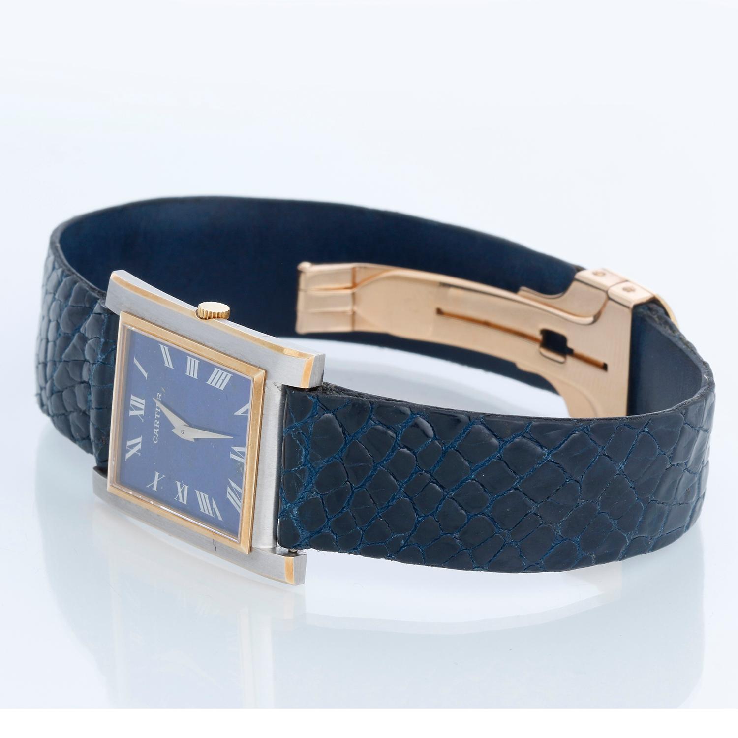Vintage Ladies Cartier Tank Lapis Lazuli Watch - Manual winding. 18k White & Yellow gold case ( 24 mm x 30 mm ). Lapis Lazuli dial. Blue strap  with 18K Yellow Gold Cartier deployant clasp. Pre-owned - vintage ca. 1970's.