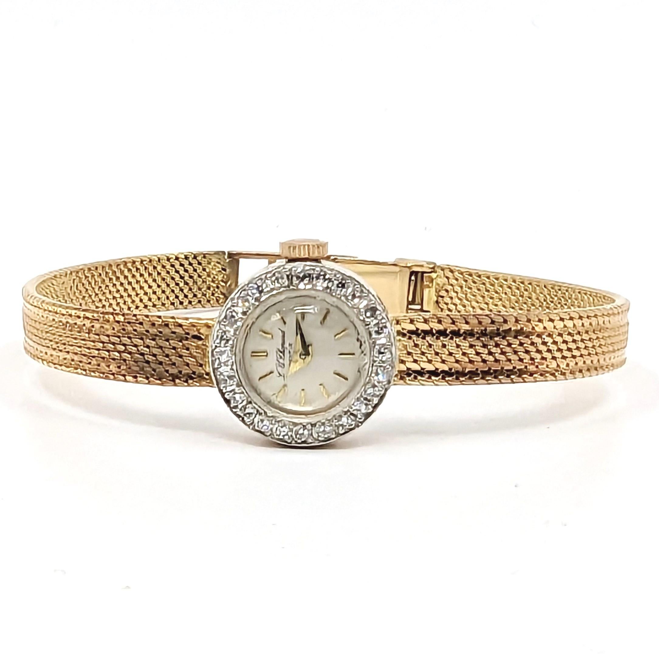 A vintage and fine L.U.Chopard ladies diamond watch in 18k solid pink/rose gold bezel lavish diamonds set, silvered dial, snap on case back with dedication engraving, attached to a solid pink/rose gold mesh bracelet with buckle closure

Circa: