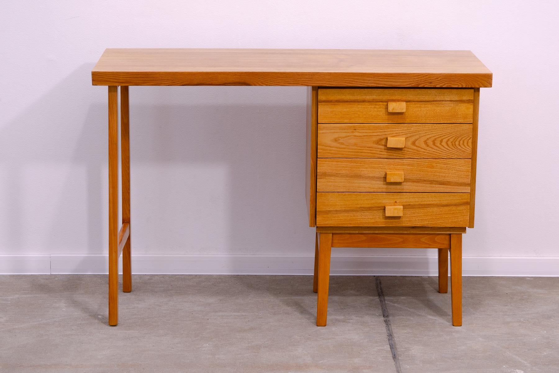 A Simple vintage beech wood writing desk from the HIKOR Písek company, 1970´s, Czechoslovakia
The design is very simple and elegant. It features a section with 4 drawers. The desk has been fully restored and is in excellent condition.

Height: 75