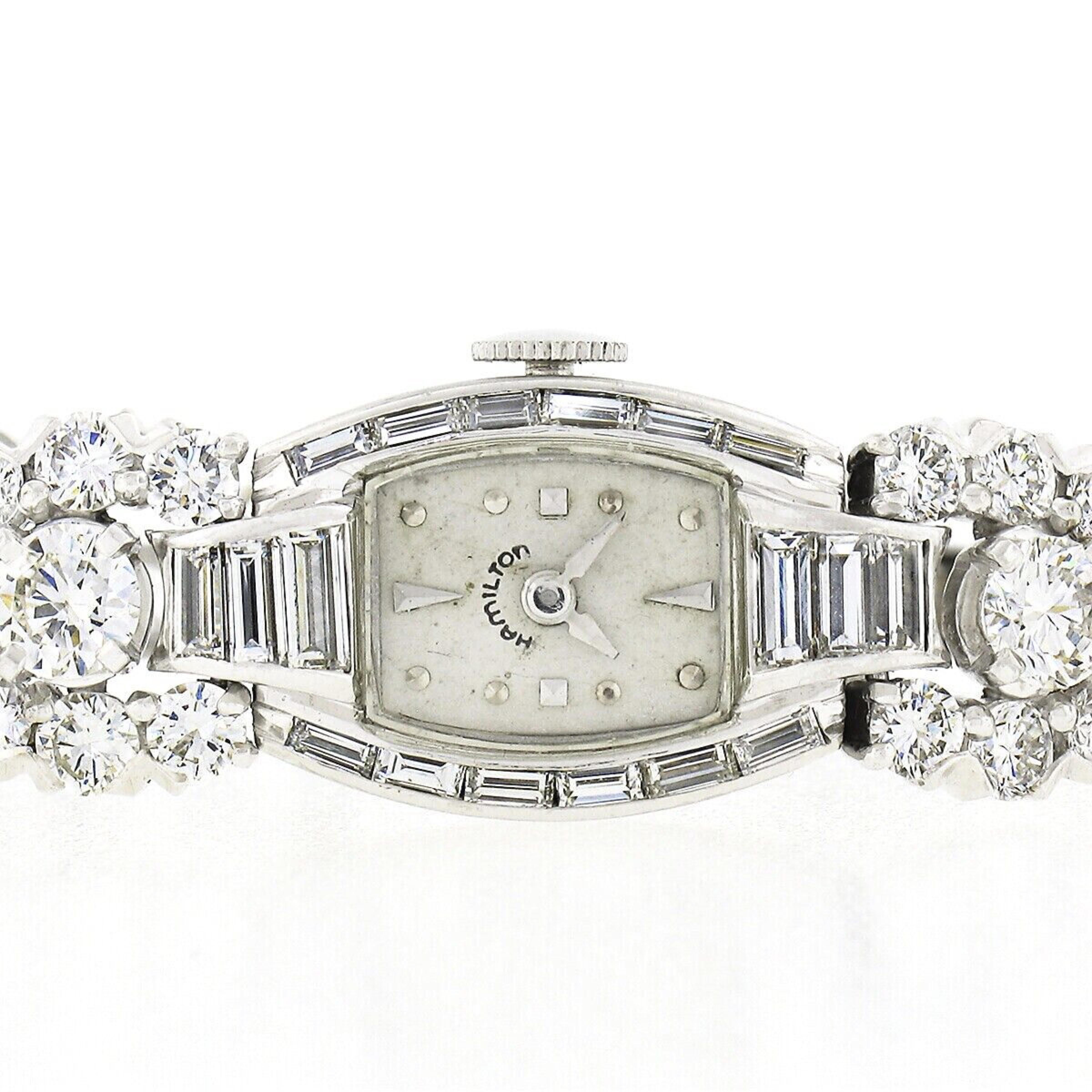 Here we have a gorgeous vintage ladies' Hamilton wrist watch with an elegantly designed solid .900 platinum case and bracelet. The case and bracelet are completely covered with approximately 6.95 carats of very fine quality diamonds. Of particular