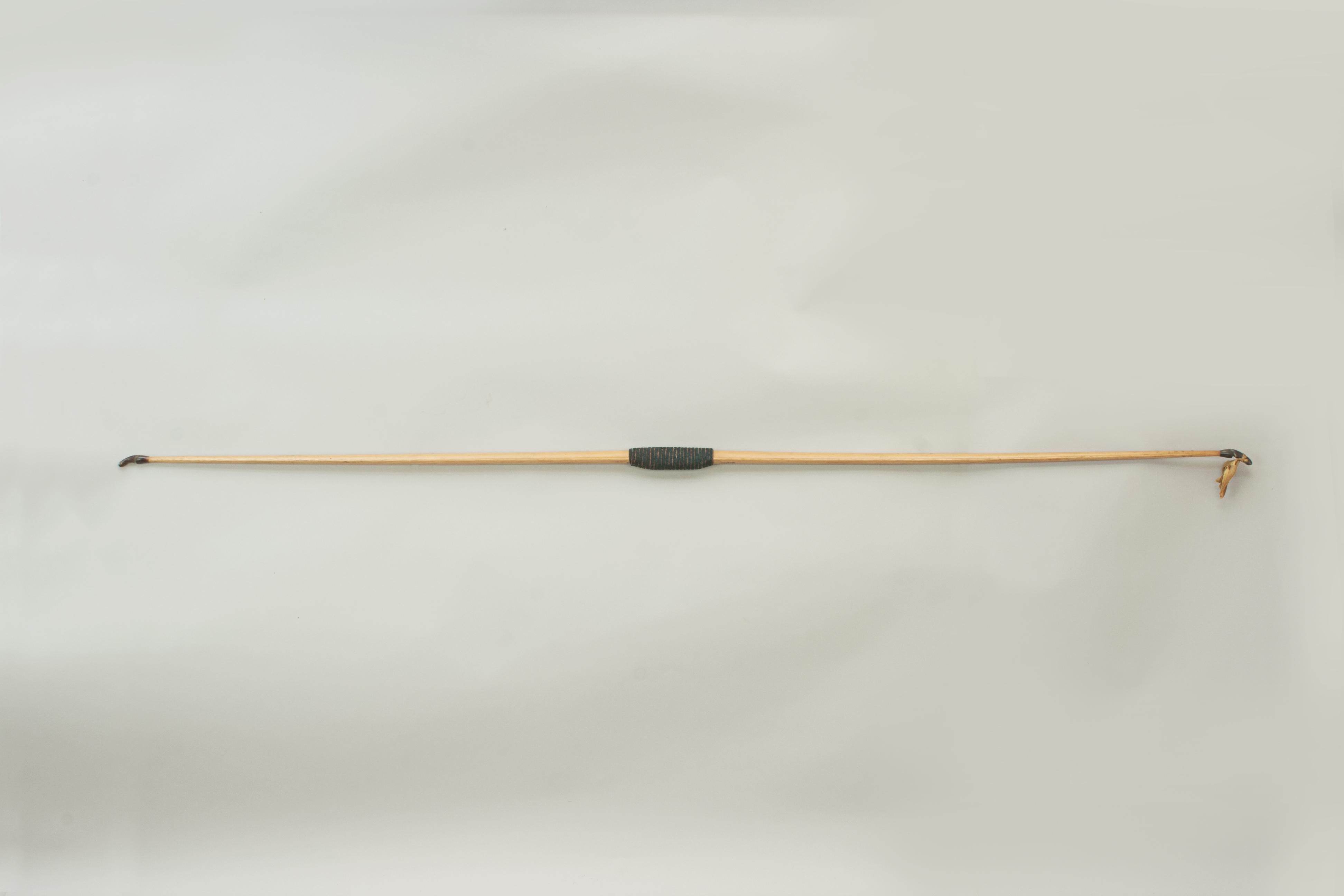 Vintage F.H. Ayres Longbow.
A very good laminated ladies archery bow produced by F.H. Ayres Ltd., London. The bow is fitted with two horn nocks and a green fabric handle. Just above the grip is the makers name 'F.H. Ayres Ltd., London' and below