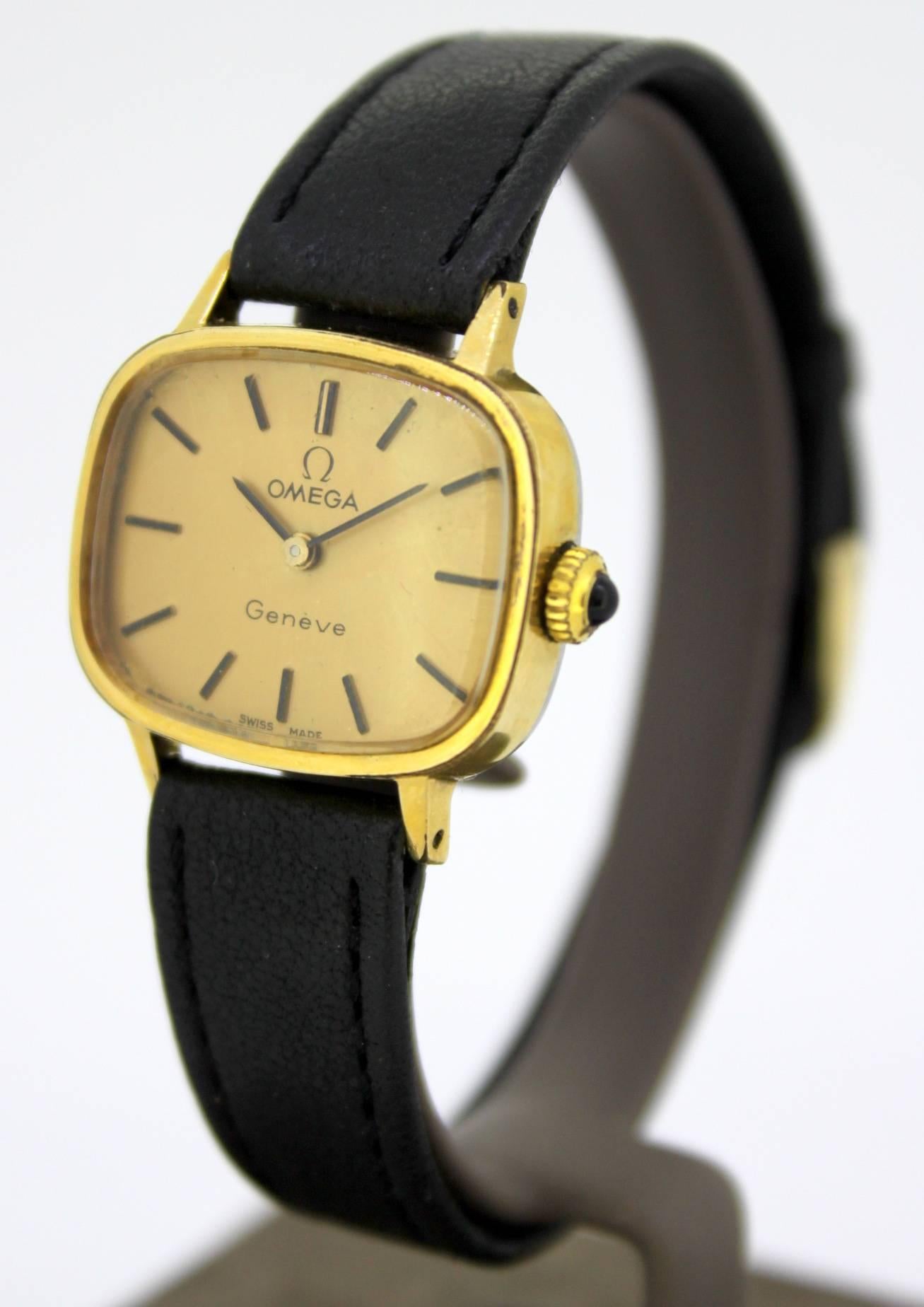 Vintage ladies Omega wristwatch, C.1950's

Gender: Ladies
Case size: 27 x 25 mm
Movement: Manual Winding
Watchband Material: Leather
Case material : Gold Plated
Display Type:	Analogue	
Dial: Gold ( See Photos )
Year : 1950's
Hands: Black
Clasp :
