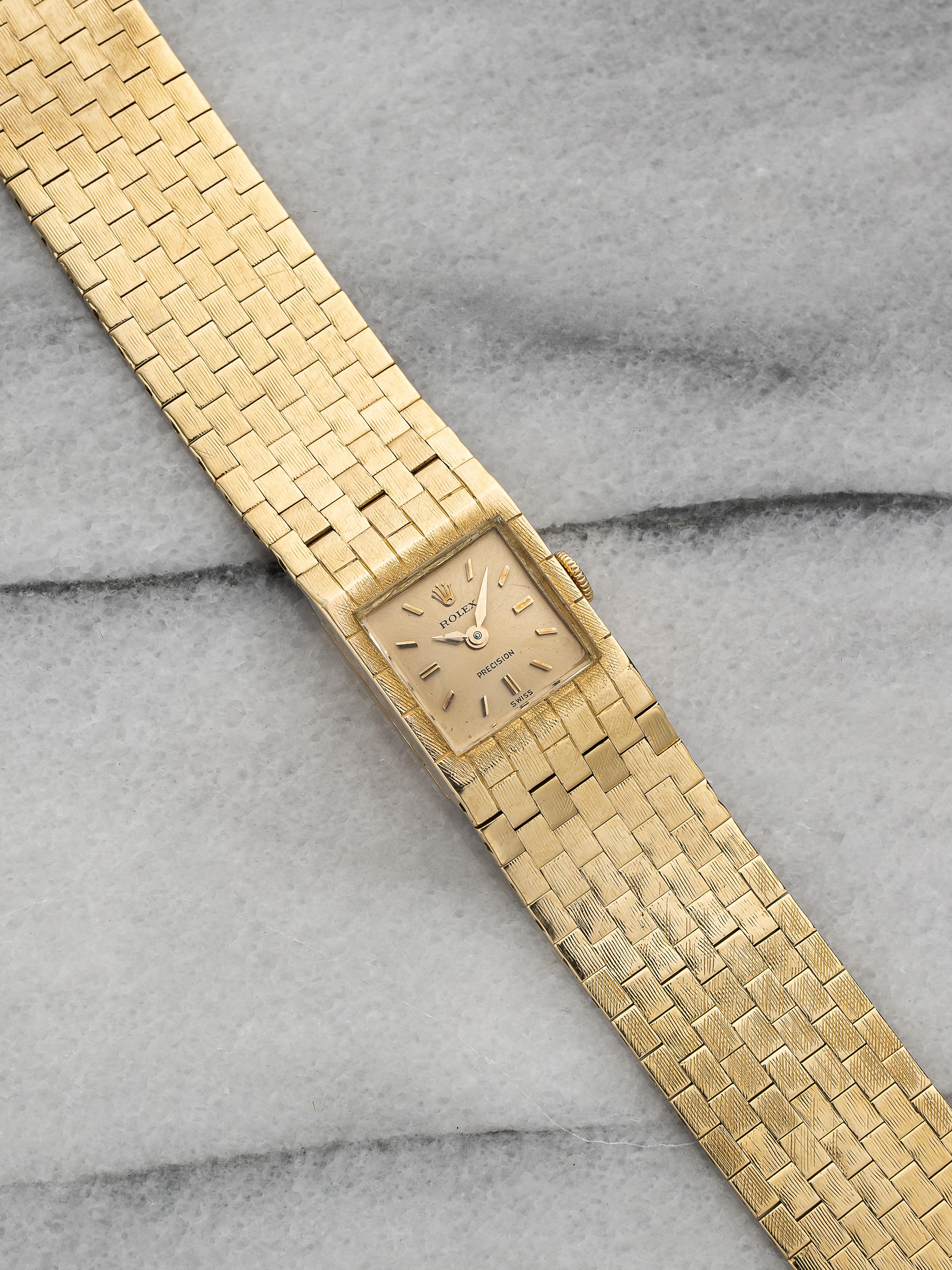 Here's a vintage ladies Precision in 18k yellow gold reference 8209 silver dial manual win from the 1950s. Keeps great time and is fully functional. Measurements include a 16x22mm case and bracelet fits up to a 7 inch wrist. Time only. Gold alpha