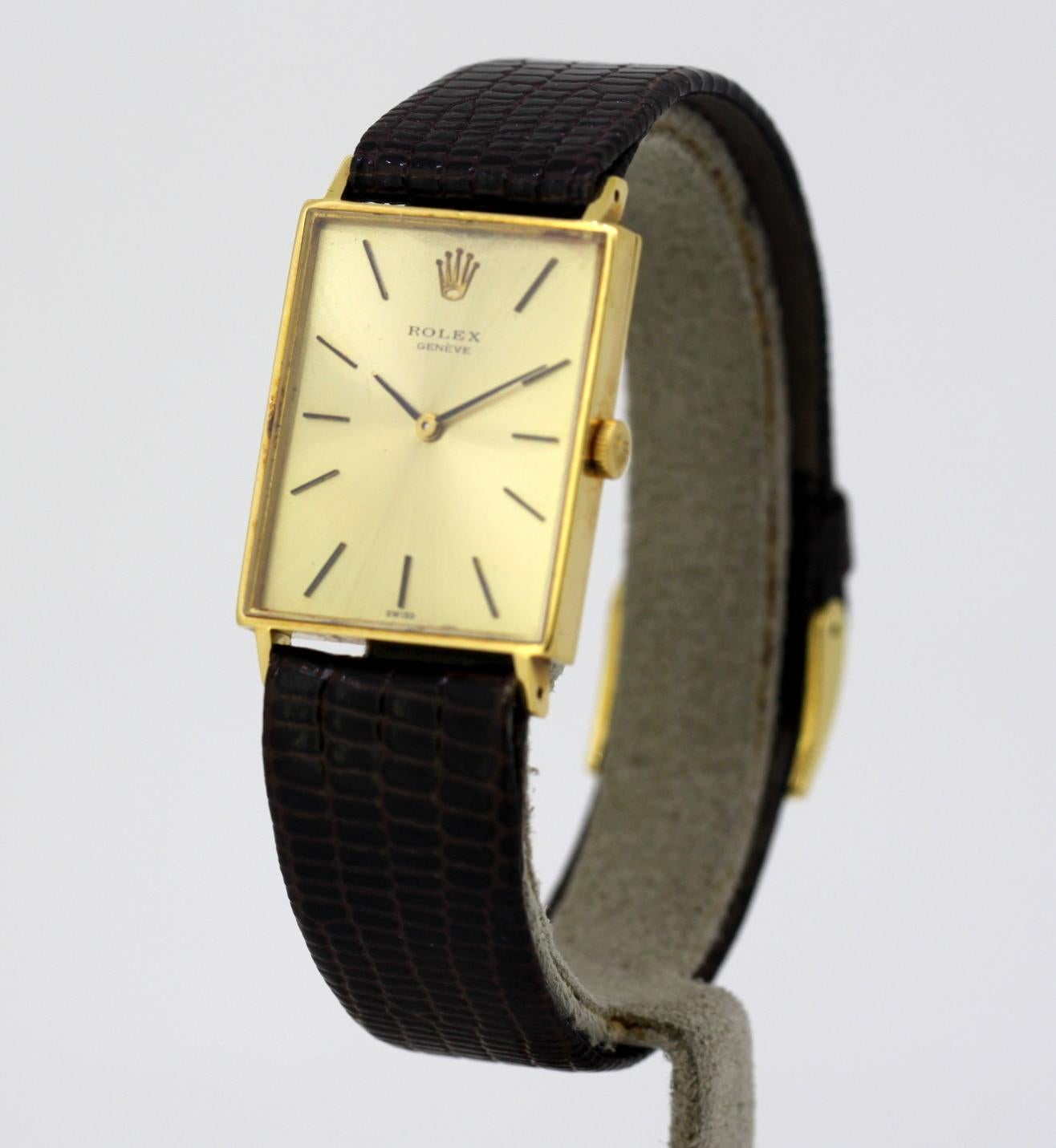 Vintage ladies Rolex wristwatch in 18k yellow gold
Circa 1960's

Reference Number: J3834
Gender:	Ladies
Case Size : 23 mm
Movement: Manual Winding
Watchband Material: Leather
Case material : 18k gold
Display Type:	Analogue	
Age: 1960's
Dial: Gold