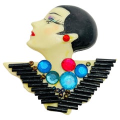 Vintage lady’s head plastic designer brooch