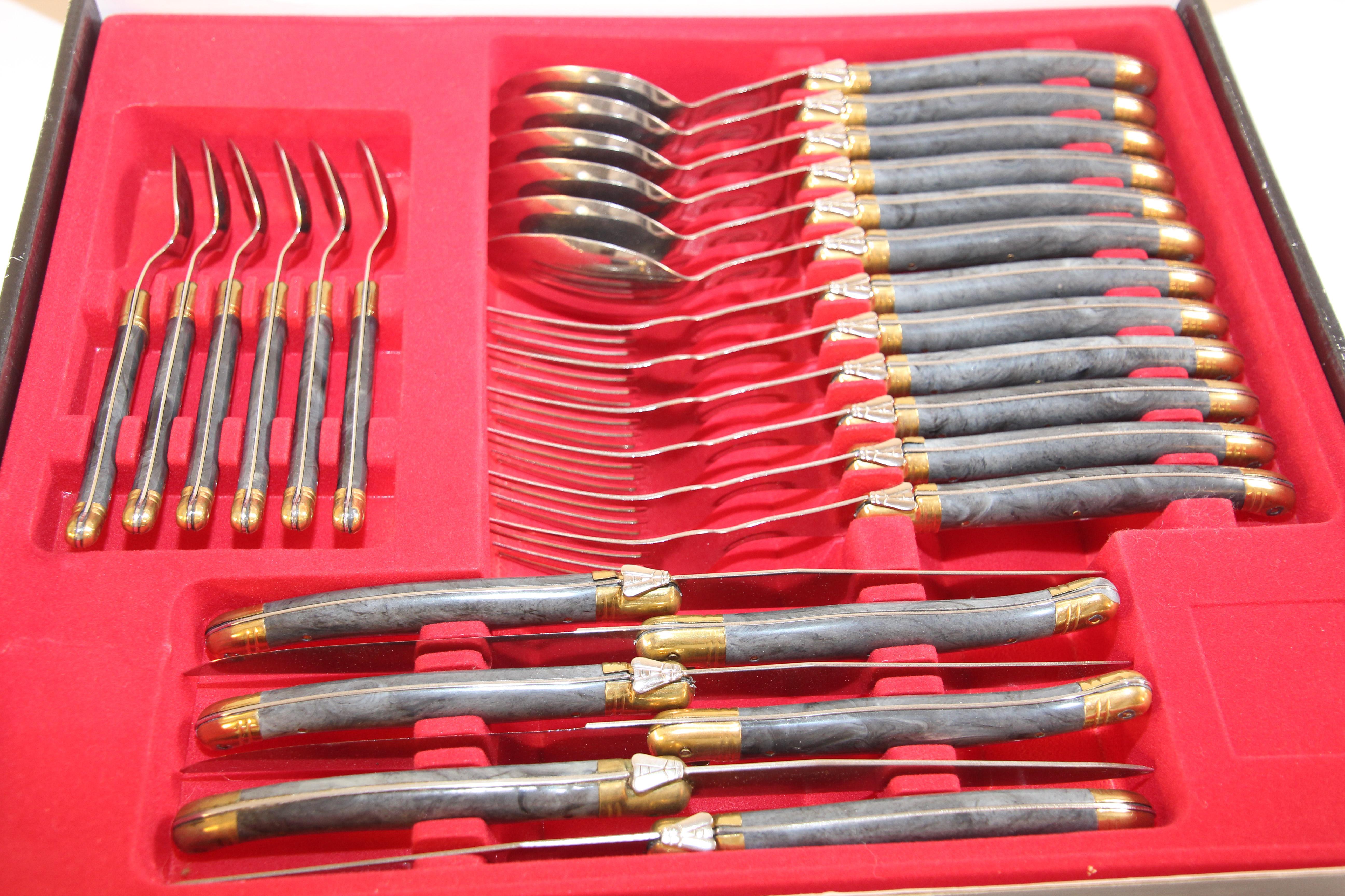 Vintage Laguiole de France 24 piece flatware set.
French maker Laguiole may be most well-known for their elegant, handcrafted knives, complete with arched blades and bee-adorned handles, 
World renowned knives from the Midi-Pyrenees region of