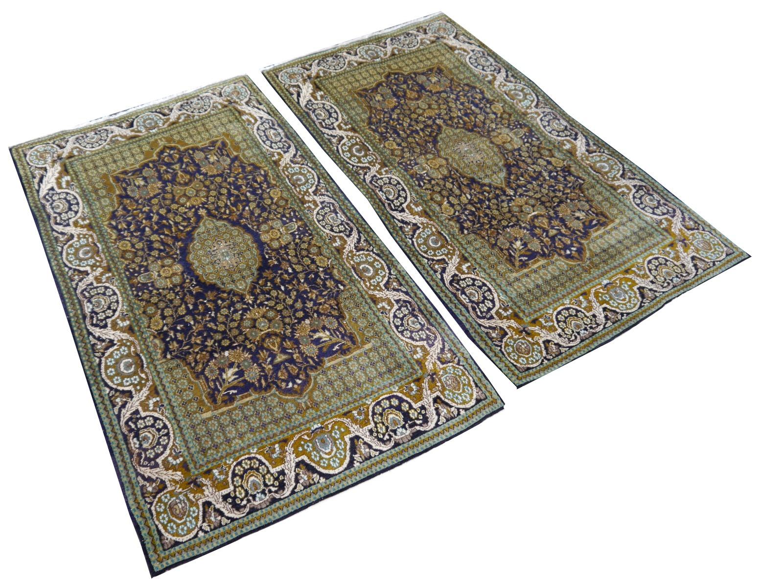 A beautiful pair of vintage Lahore Kashmir bedside rugs in blue green turquoise beige, hand knotted wool and silk.
 
Construction
This pair of bedside rugs has a pile made of fine spun Wool with some small silk highlights. The rugs are very fine and