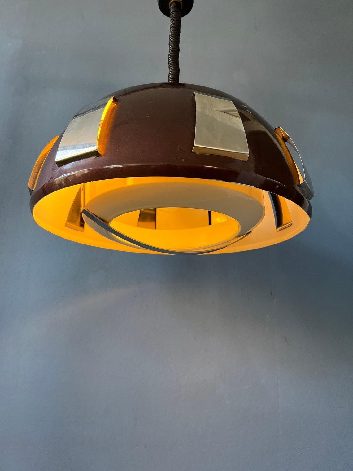 Mid century pendant light by Lakro Amstelveen. The lamp is made out of steel and has a dark brown/sparkle lacquer. The height of the lamp can easily be adjusted with the rise-and-fall mechanism. The lamp requires one E27/26 (standard) lightbulb.